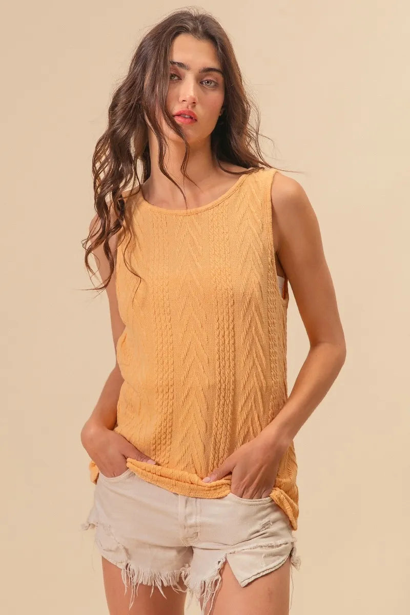 Textured sweater knit twist back sleeveless top with cable-knit design, slightly stretchy.