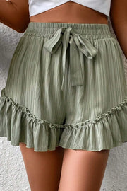 High-waist V-front Bermuda denim shorts with pockets.
