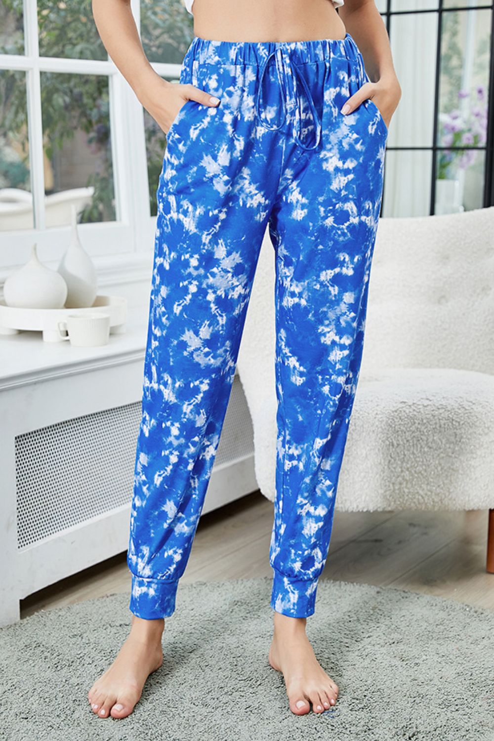 Tie-dye drawstring waist joggers with pockets, slightly stretchy.