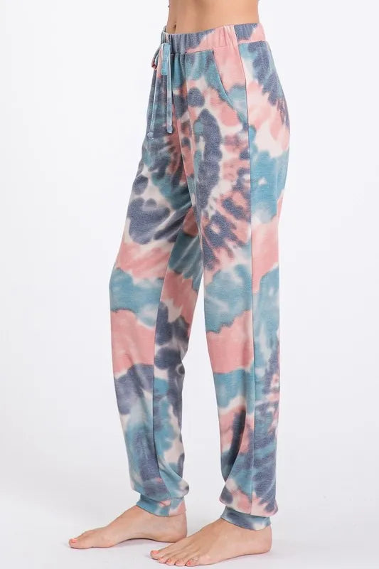 Tie dye French terry casual pants with drawstring and pockets.