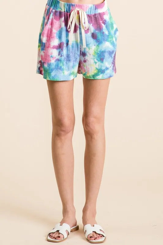 High-waist V-front Bermuda denim shorts with pockets.