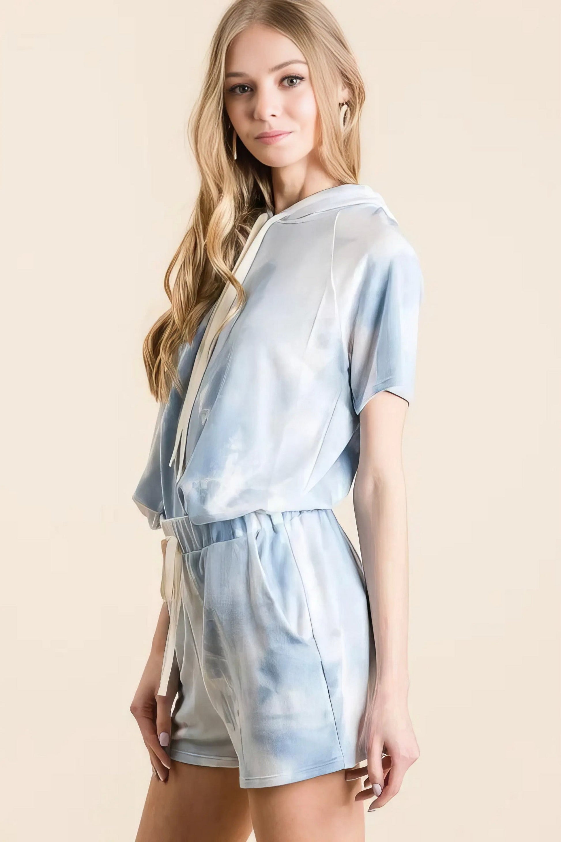 Tie dye french terry hoodie top and bottom set, women's comfortable two-piece outfit, stylish tie-dye pattern, soft French terry fabric, drawstring hoodie, practical pockets, moderate stretch polyester, ideal for lounging or casual wear
