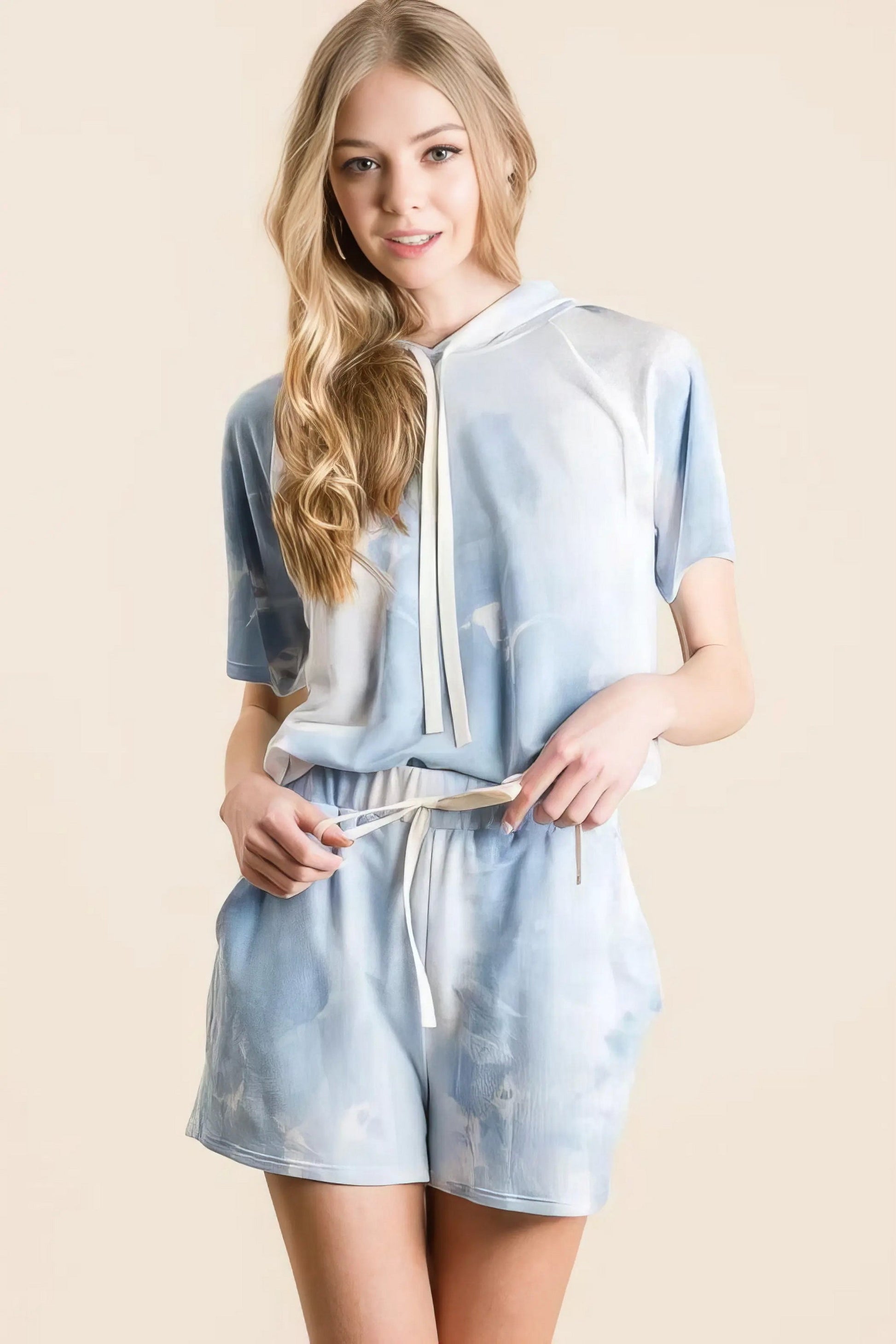 Tie dye french terry hoodie top and bottom set, women's comfortable two-piece outfit, stylish tie-dye pattern, soft French terry fabric, drawstring hoodie, practical pockets, moderate stretch polyester, ideal for lounging or casual wear