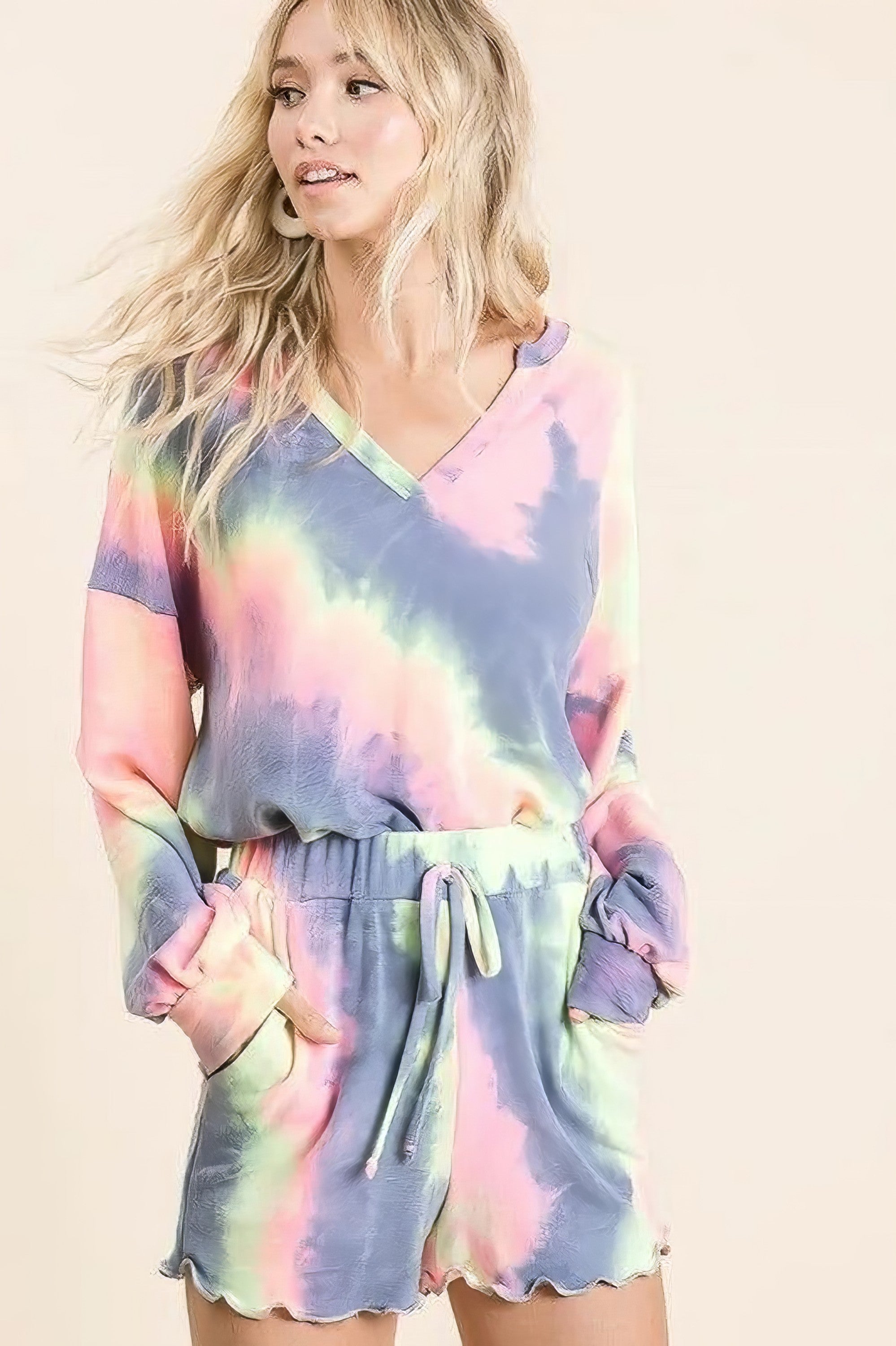 Tie dye French terry shorts with curly edge and drawstring.