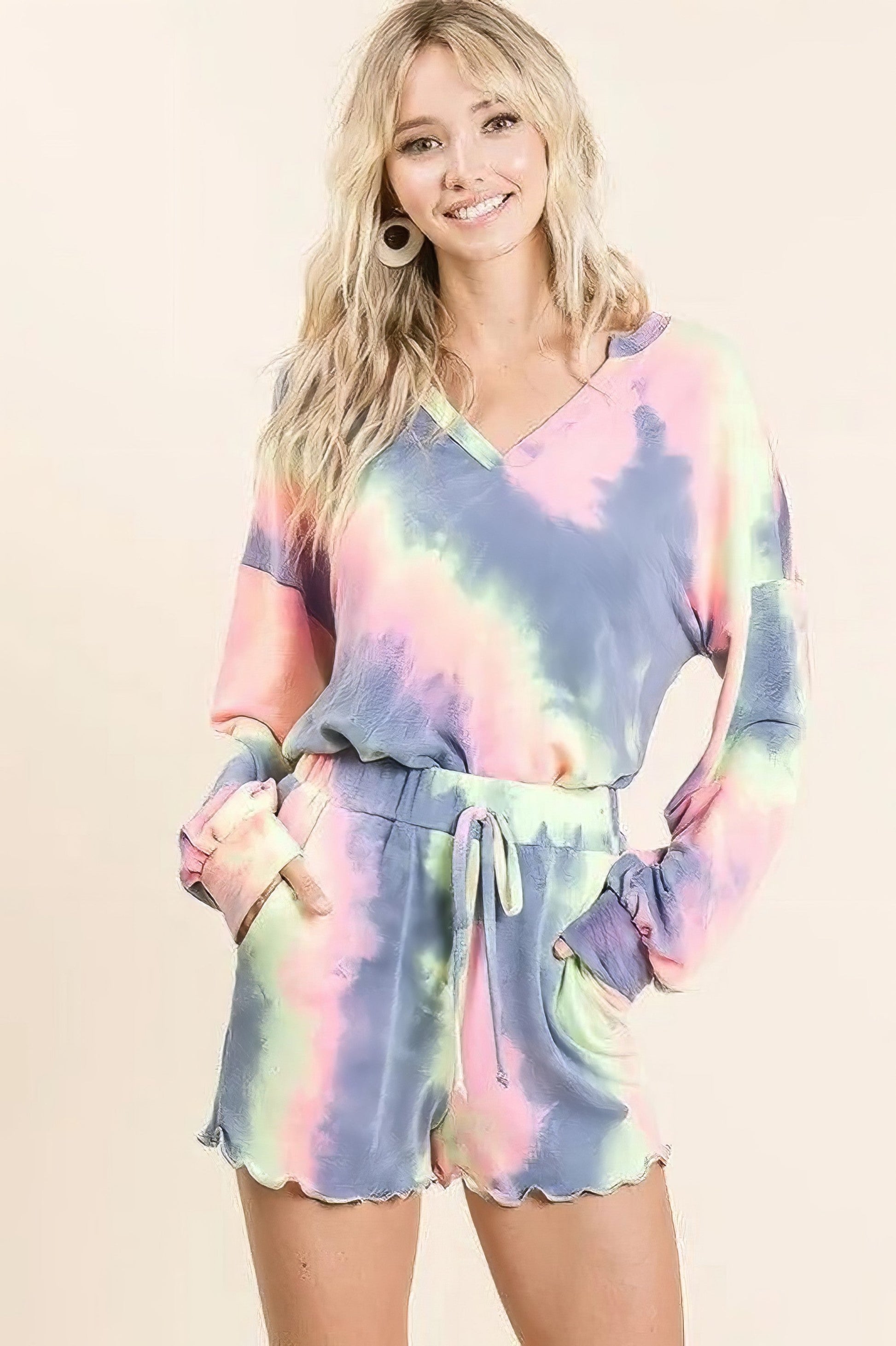 Tie dye French terry shorts with curly edge and drawstring.