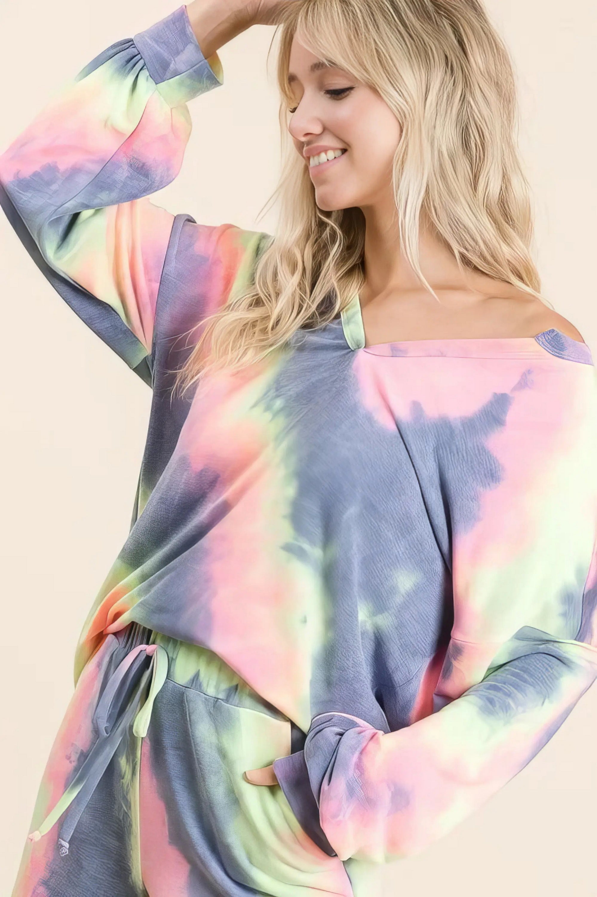Tie dye french terry top and shorts set, women's fashionable two-piece outfit, comfortable French terry fabric, stylish tie-dye pattern, raw hem shorts, practical pockets, drawstring shorts, moderate stretch cotton, ideal for lounging or casual wear