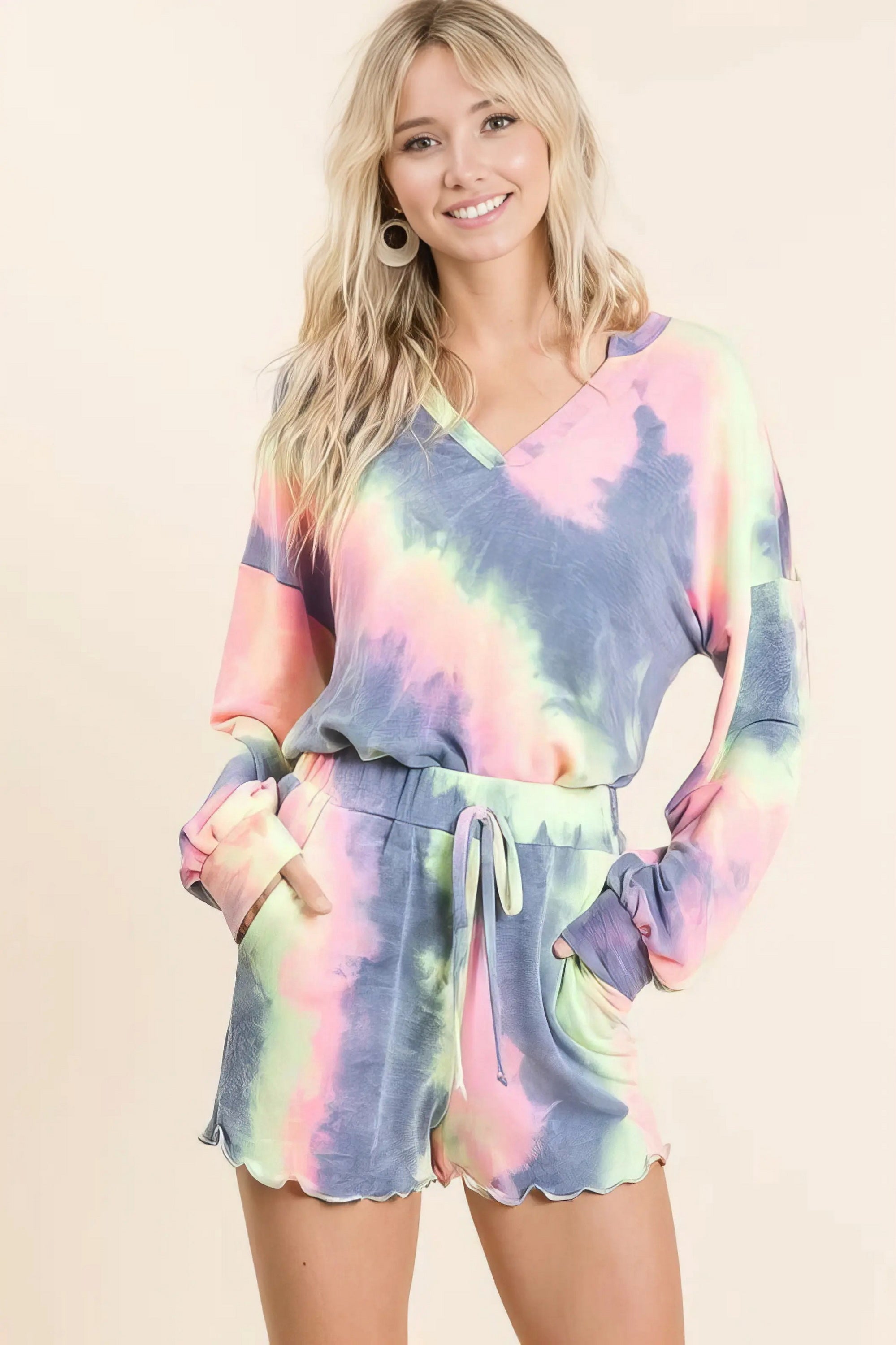 Tie dye french terry top and shorts set, women's fashionable two-piece outfit, comfortable French terry fabric, stylish tie-dye pattern, raw hem shorts, practical pockets, drawstring shorts, moderate stretch cotton, ideal for lounging or casual wear