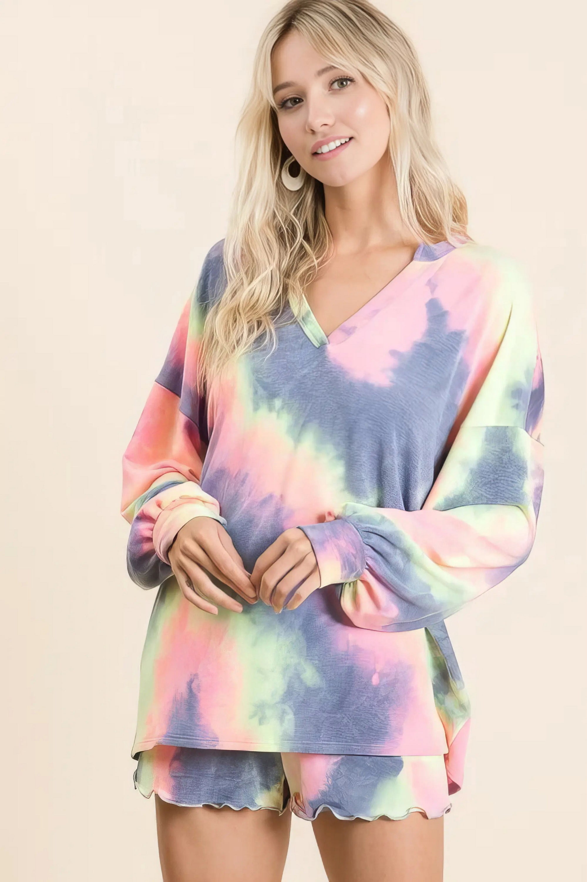 Tie dye french terry top and shorts set, women's fashionable two-piece outfit, comfortable French terry fabric, stylish tie-dye pattern, raw hem shorts, practical pockets, drawstring shorts, moderate stretch cotton, ideal for lounging or casual wear