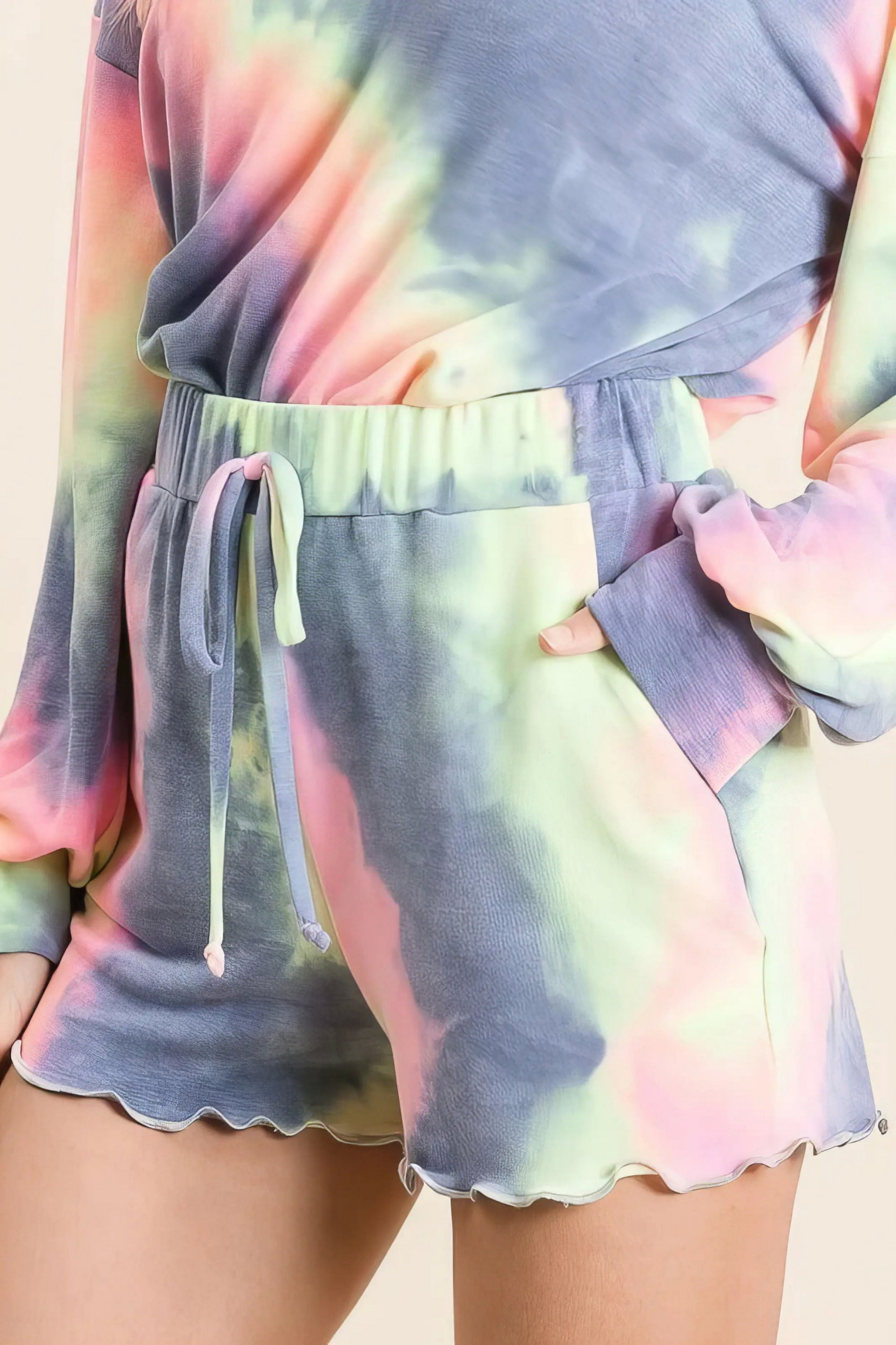 Tie dye french terry top and shorts set, women's fashionable two-piece outfit, comfortable French terry fabric, stylish tie-dye pattern, raw hem shorts, practical pockets, drawstring shorts, moderate stretch cotton, ideal for lounging or casual wear