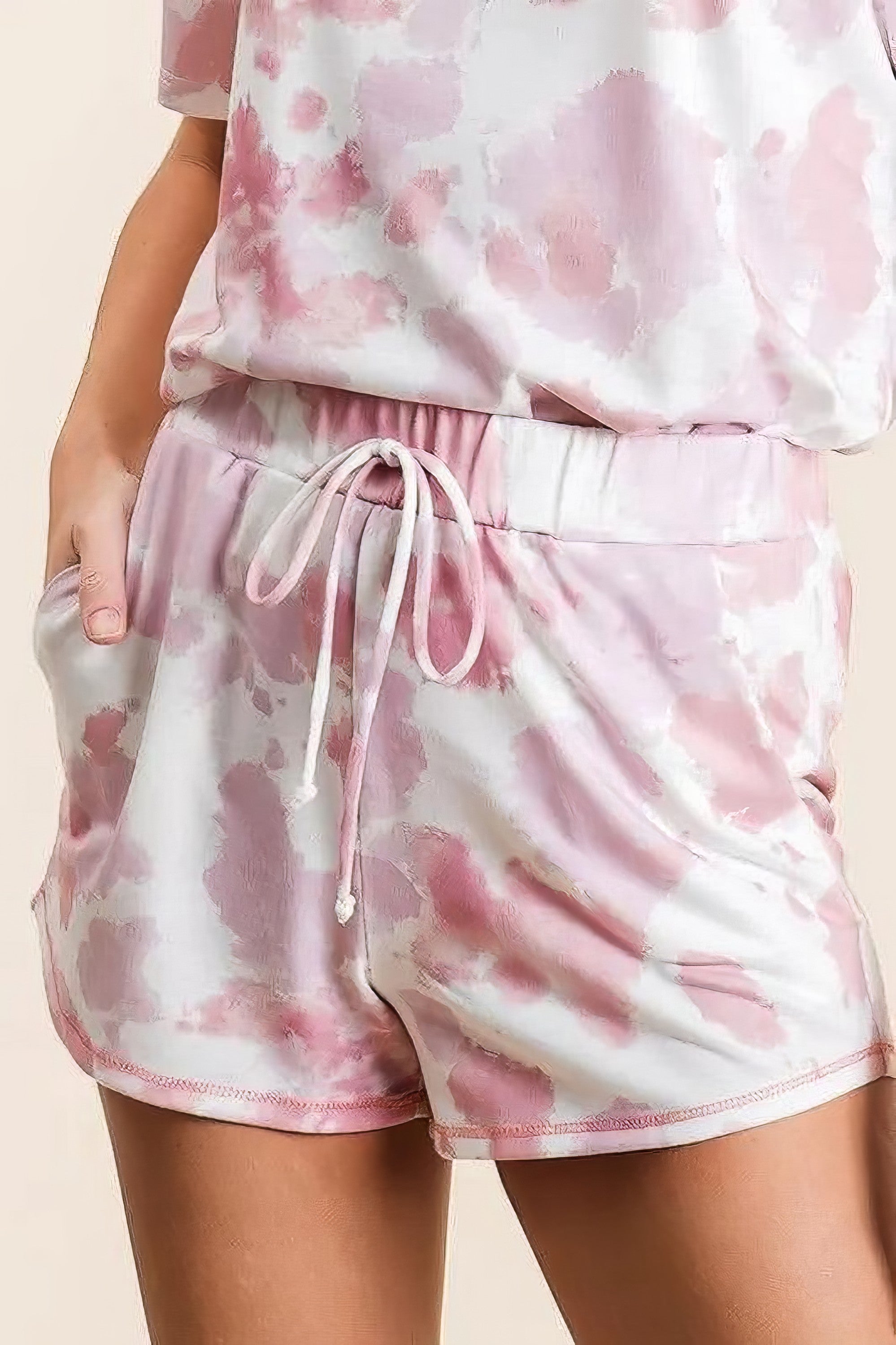 Tie dye print terry shorts with side pockets and drawstring.