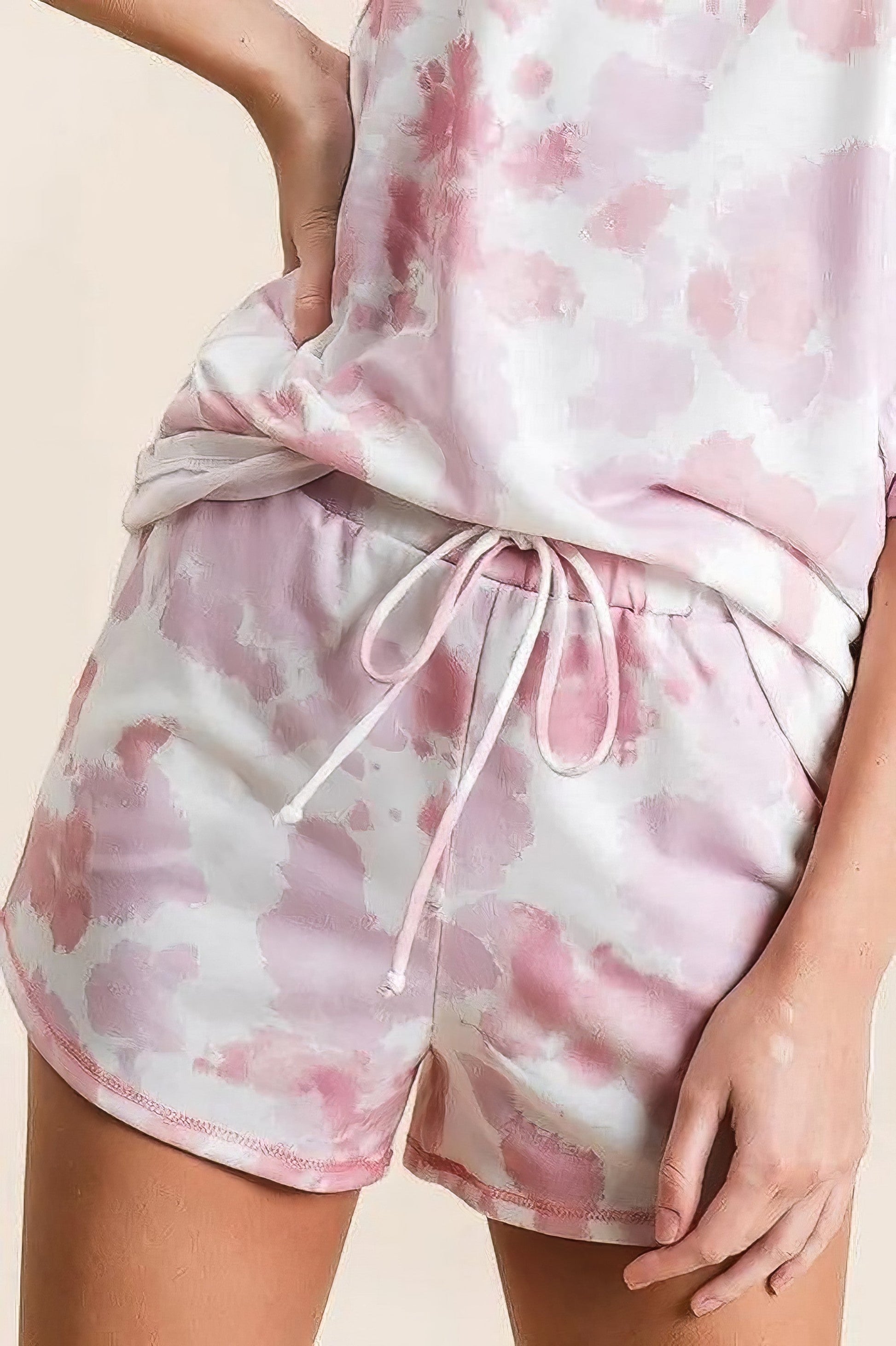 Tie dye print terry shorts with side pockets and drawstring.