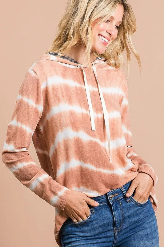 Tie dye stripe terry drawstring hoodie with leopard print accents.