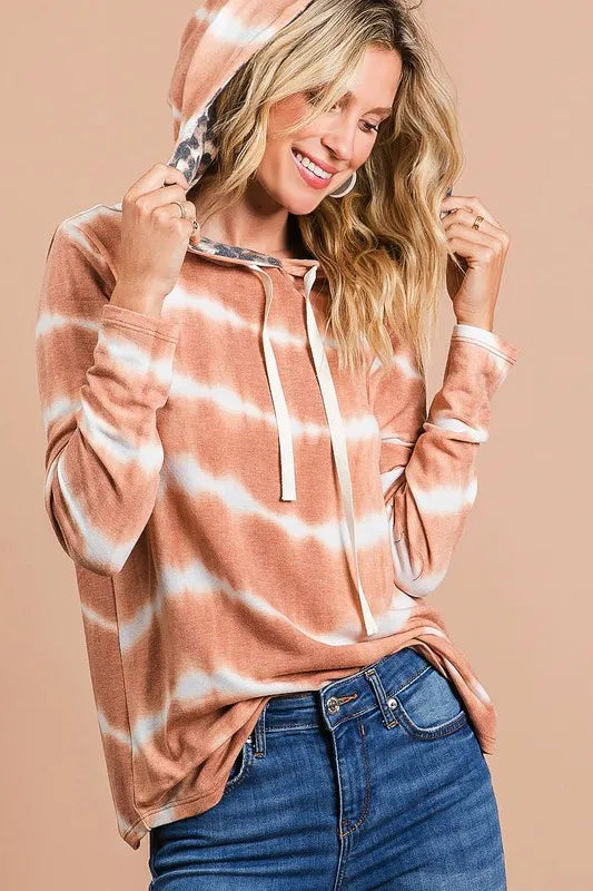 Tie dye stripe terry drawstring hoodie with leopard print accents.