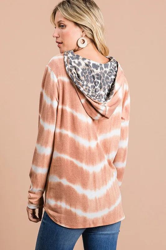 Tie dye stripe terry drawstring hoodie with leopard print accents.
