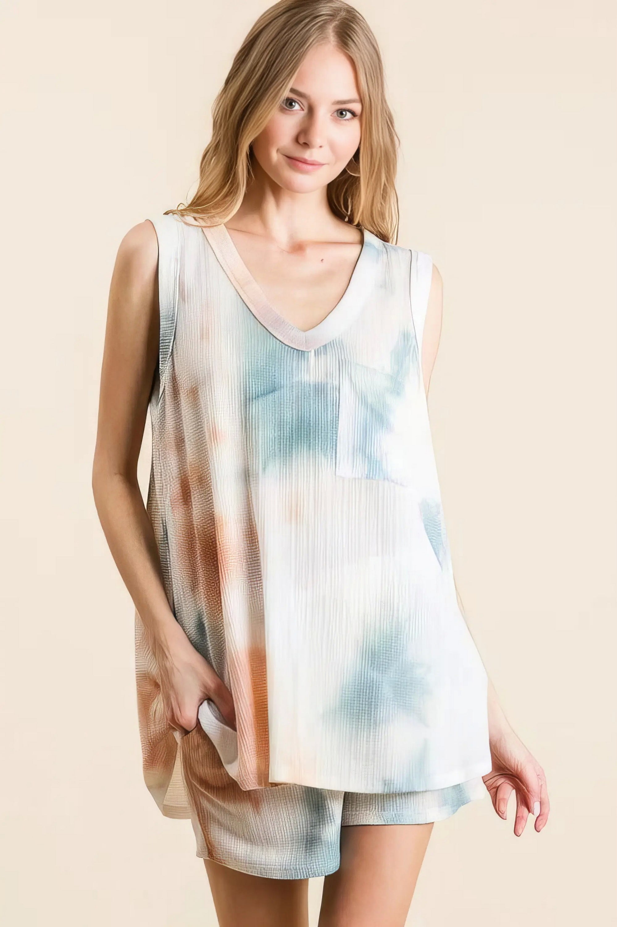 tie dye textured knit top and shorts set unique, distinct women's outfit, trendy two-piece set, colorful tie dye pattern, comfortable textured knit, stylish modern look, ideal for relaxed and fashionable wear