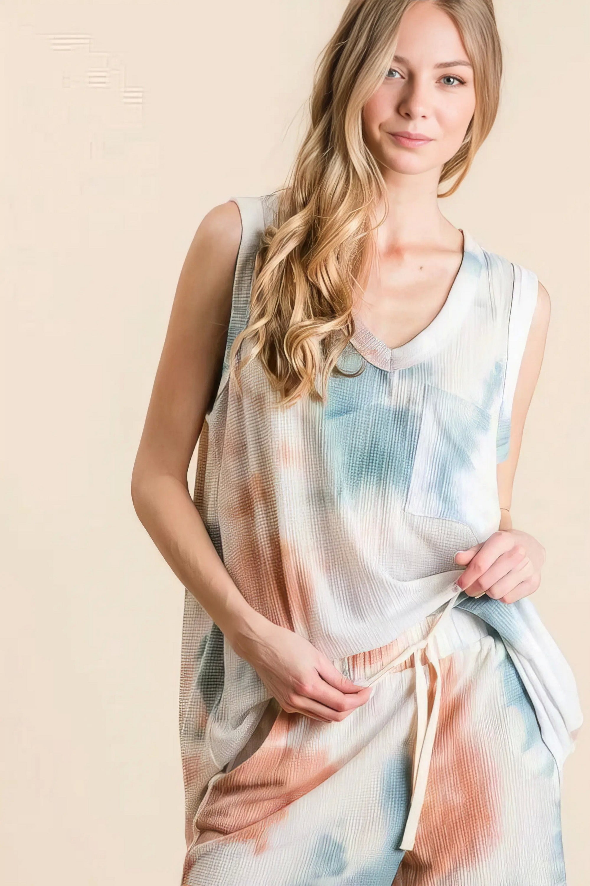 tie dye textured knit top and shorts set unique, distinct women's outfit, trendy two-piece set, colorful tie dye pattern, comfortable textured knit, stylish modern look, ideal for relaxed and fashionable wear