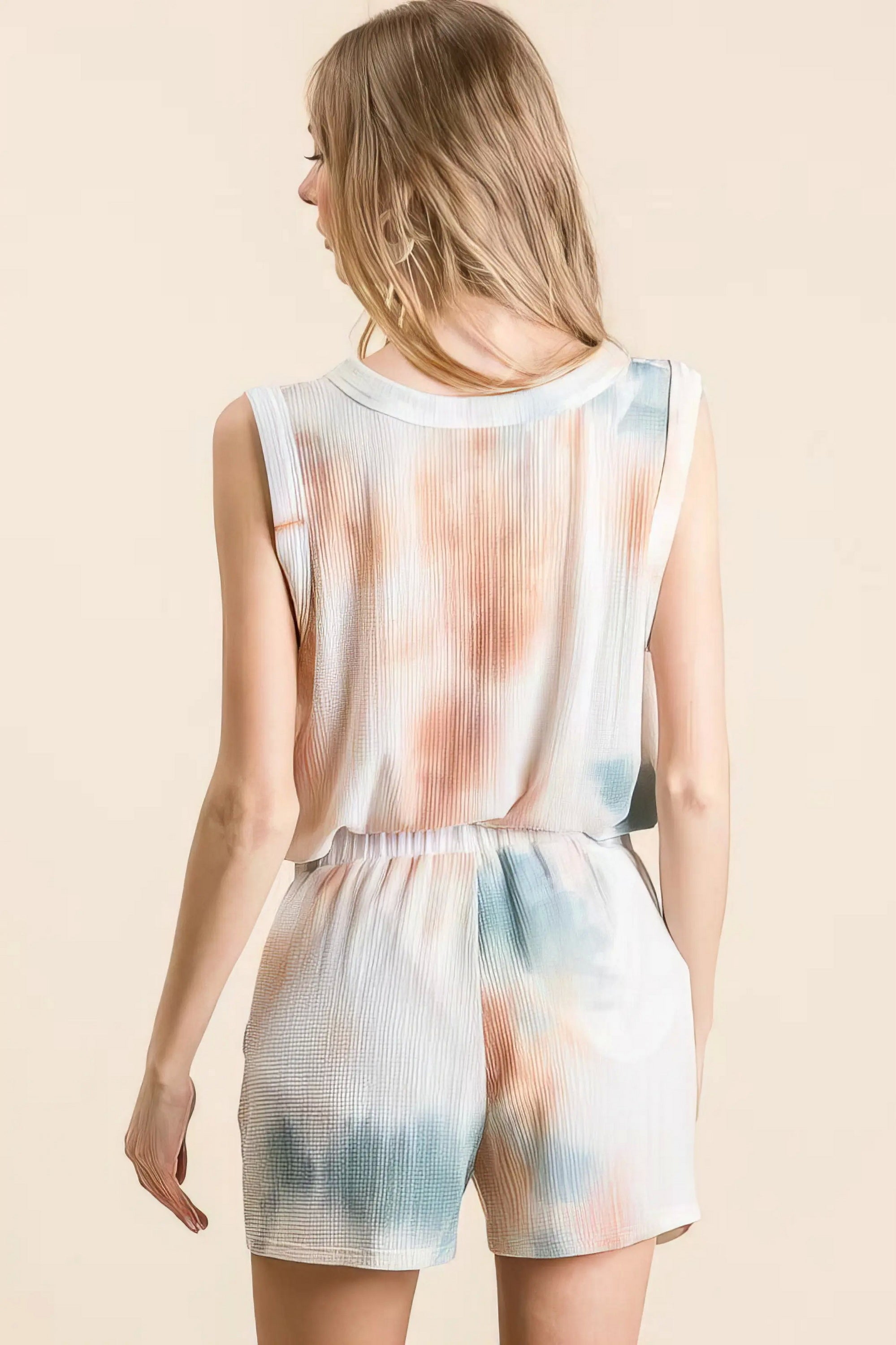 tie dye textured knit top and shorts set unique, distinct women's outfit, trendy two-piece set, colorful tie dye pattern, comfortable textured knit, stylish modern look, ideal for relaxed and fashionable wear
