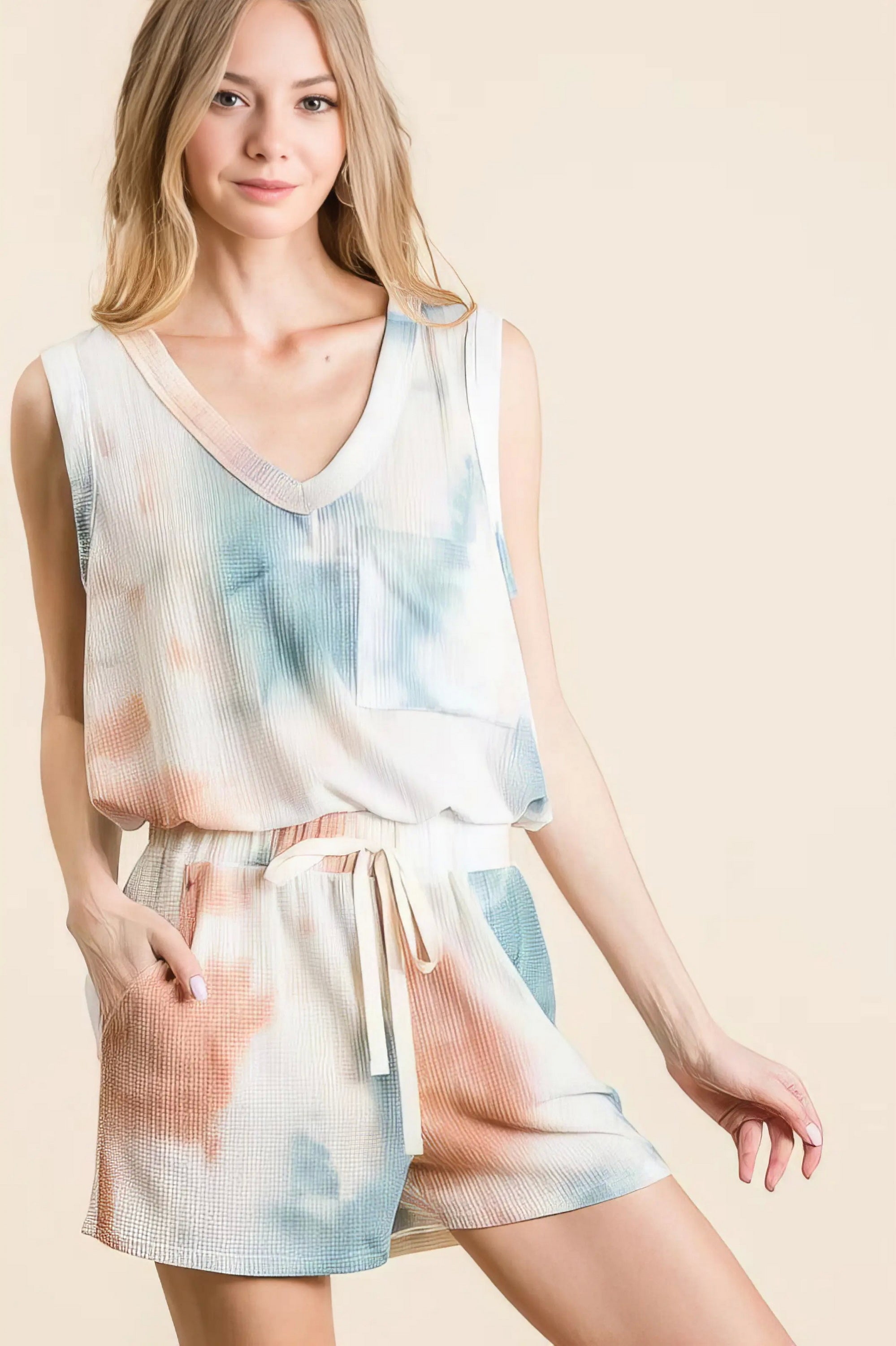 tie dye textured knit top and shorts set unique, distinct women's outfit, trendy two-piece set, colorful tie dye pattern, comfortable textured knit, stylish modern look, ideal for relaxed and fashionable wear