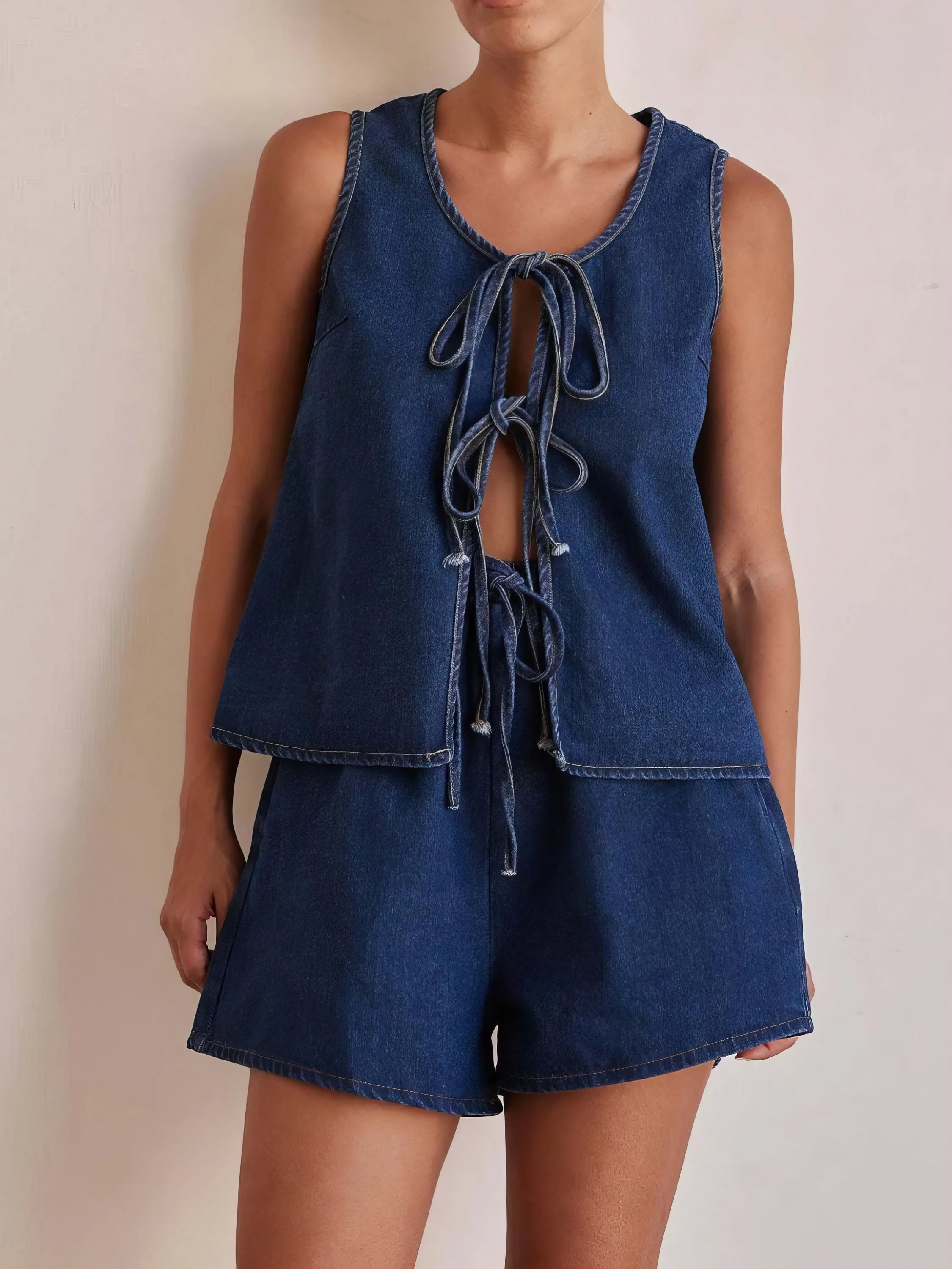 tie front vest and shorts denim set, chic edgy women's outfit, stylish two-piece set, trendy denim ensemble, comfortable vest top, fashionable denim shorts, perfect for a statement look