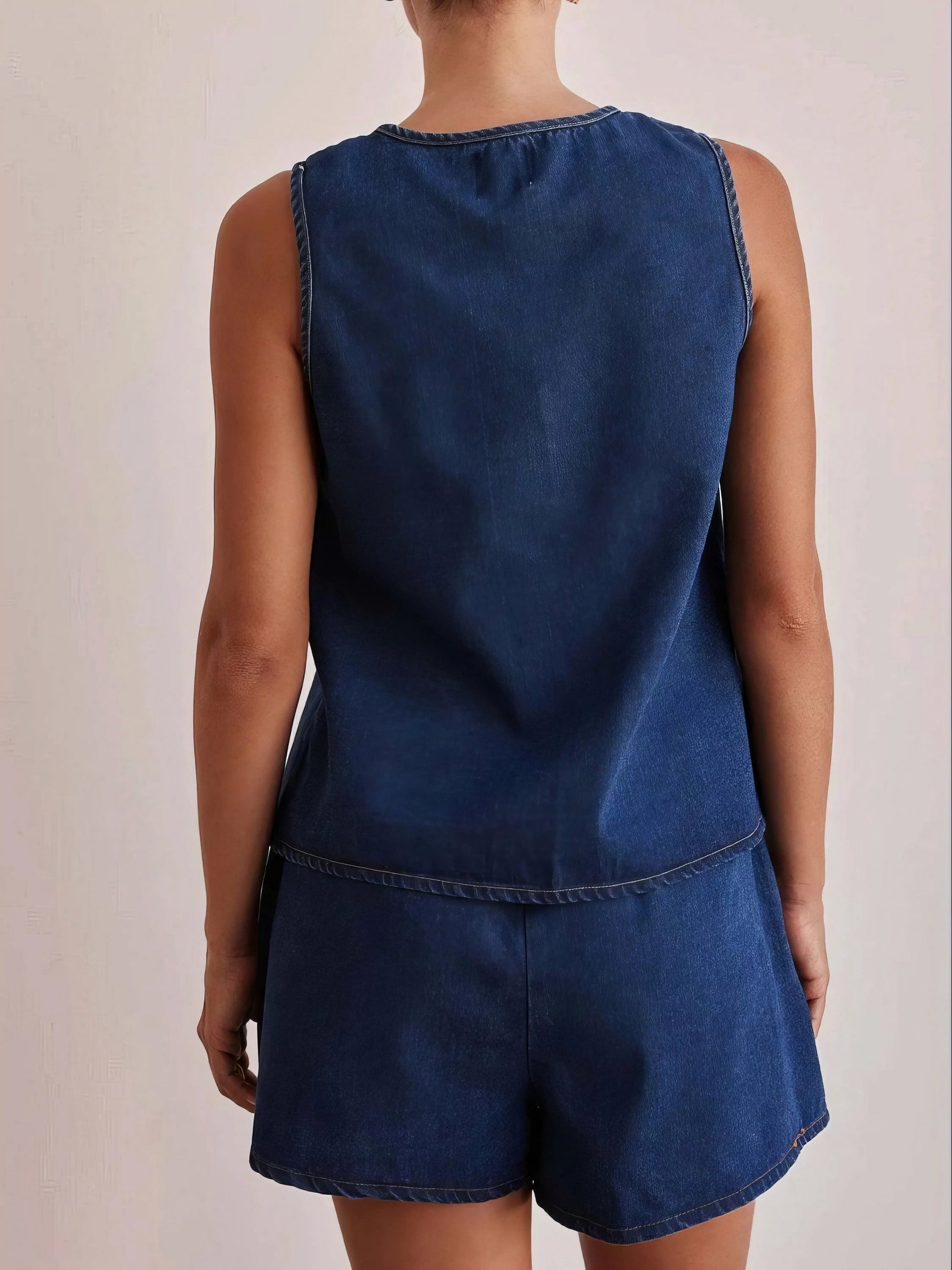 tie front vest and shorts denim set, chic edgy women's outfit, stylish two-piece set, trendy denim ensemble, comfortable vest top, fashionable denim shorts, perfect for a statement look