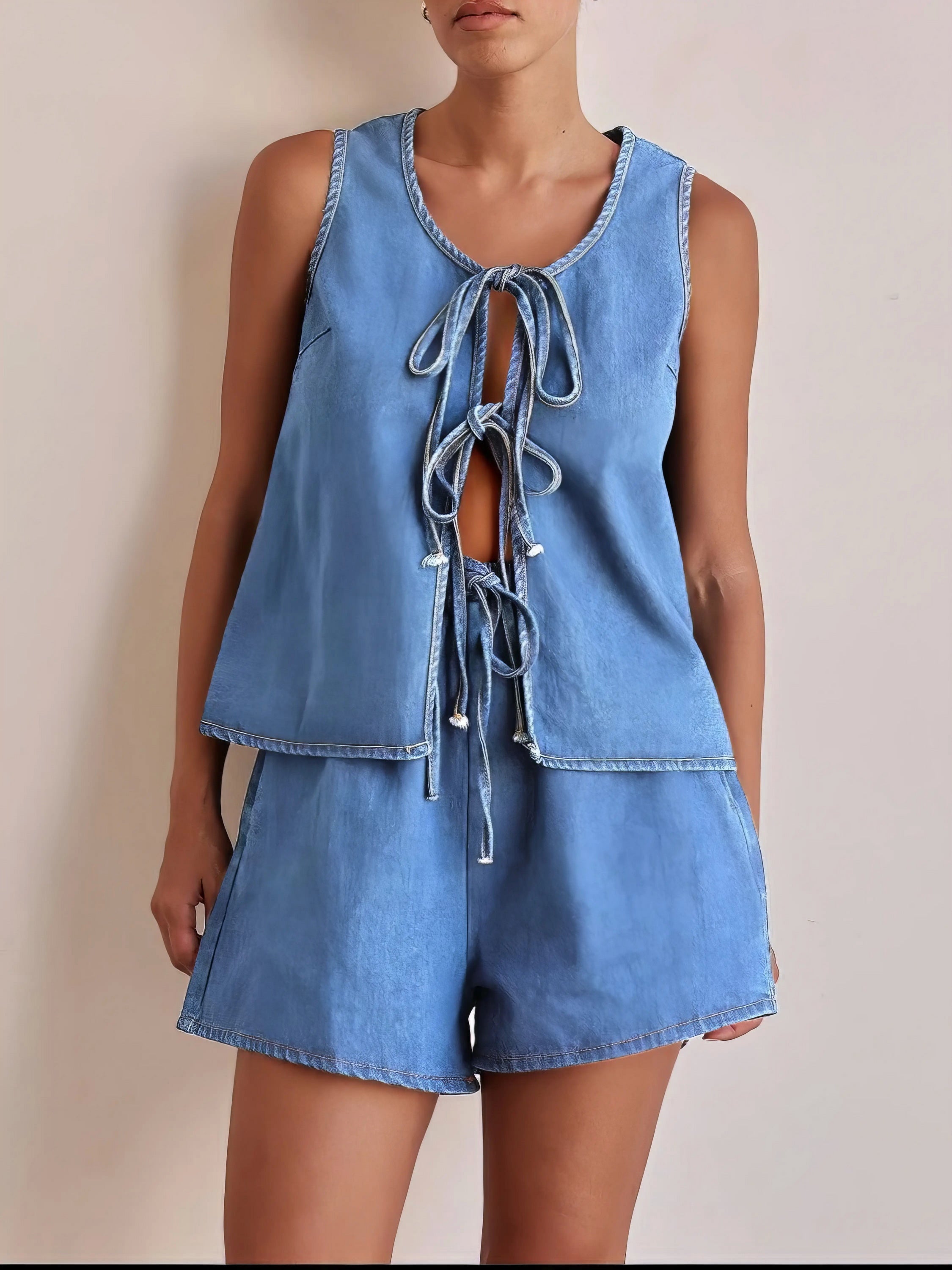 tie front vest and shorts denim set, chic edgy women's outfit, stylish two-piece set, trendy denim ensemble, comfortable vest top, fashionable denim shorts, perfect for a statement look