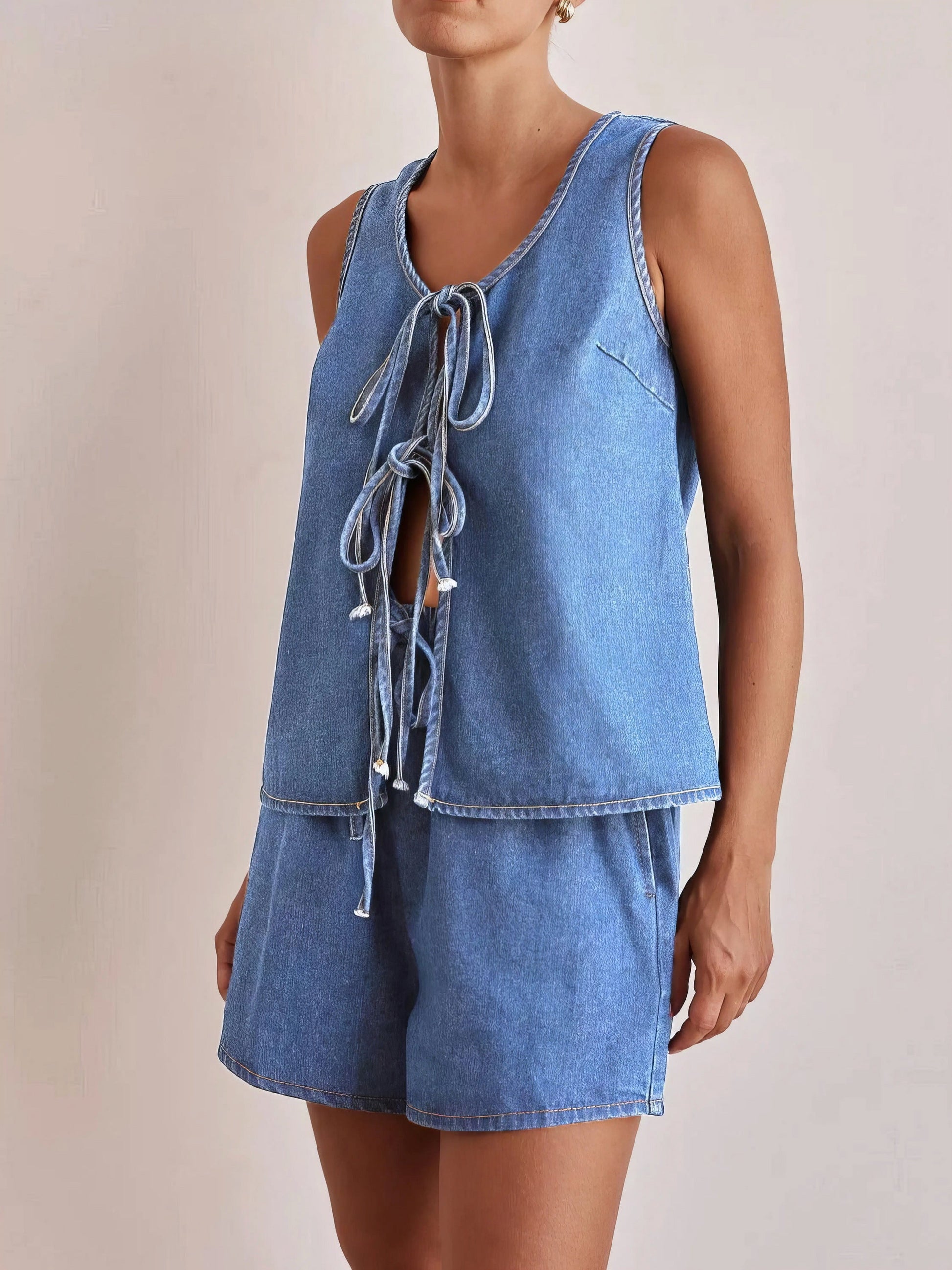 tie front vest and shorts denim set, chic edgy women's outfit, stylish two-piece set, trendy denim ensemble, comfortable vest top, fashionable denim shorts, perfect for a statement look