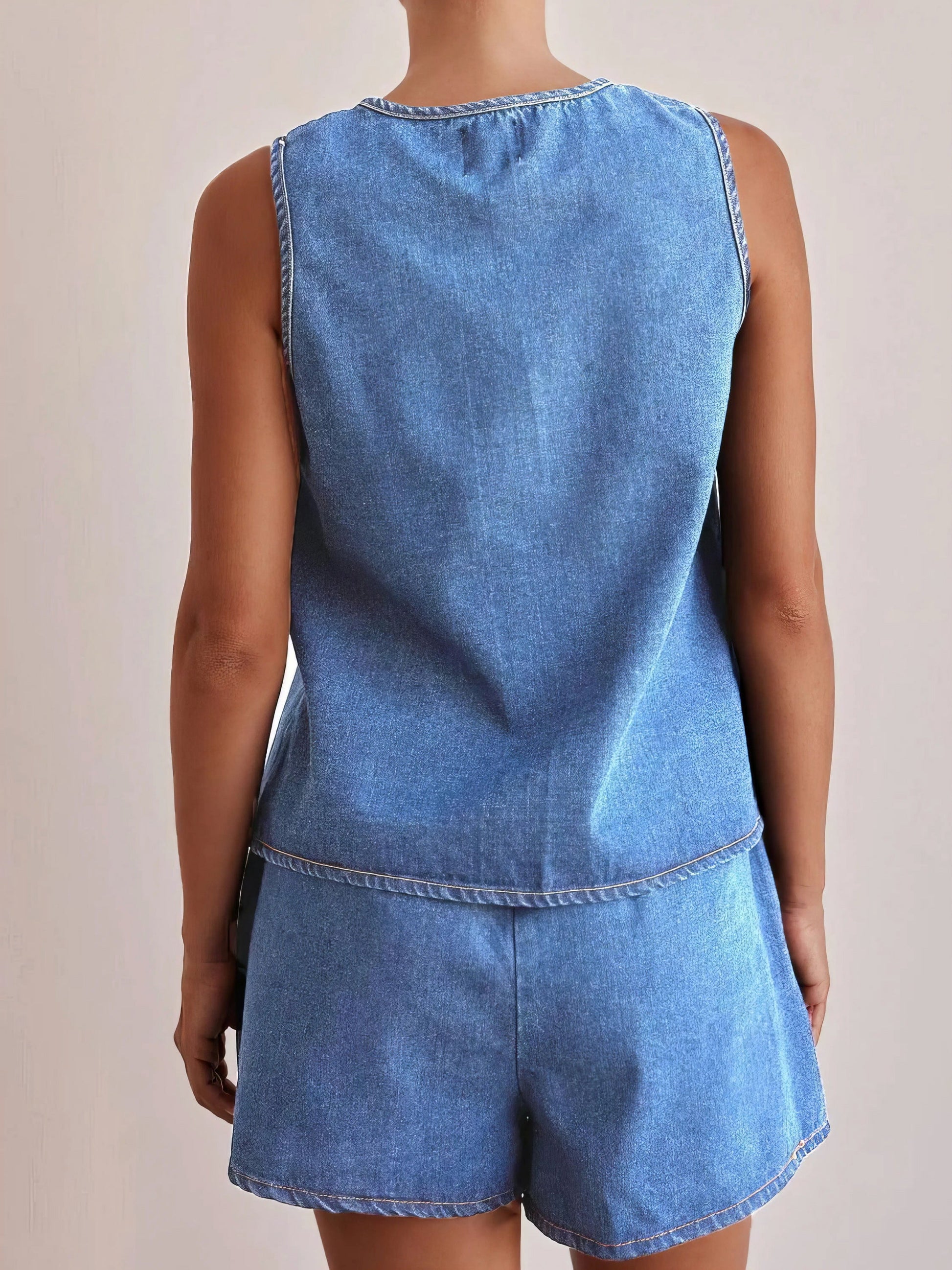 tie front vest and shorts denim set, chic edgy women's outfit, stylish two-piece set, trendy denim ensemble, comfortable vest top, fashionable denim shorts, perfect for a statement look