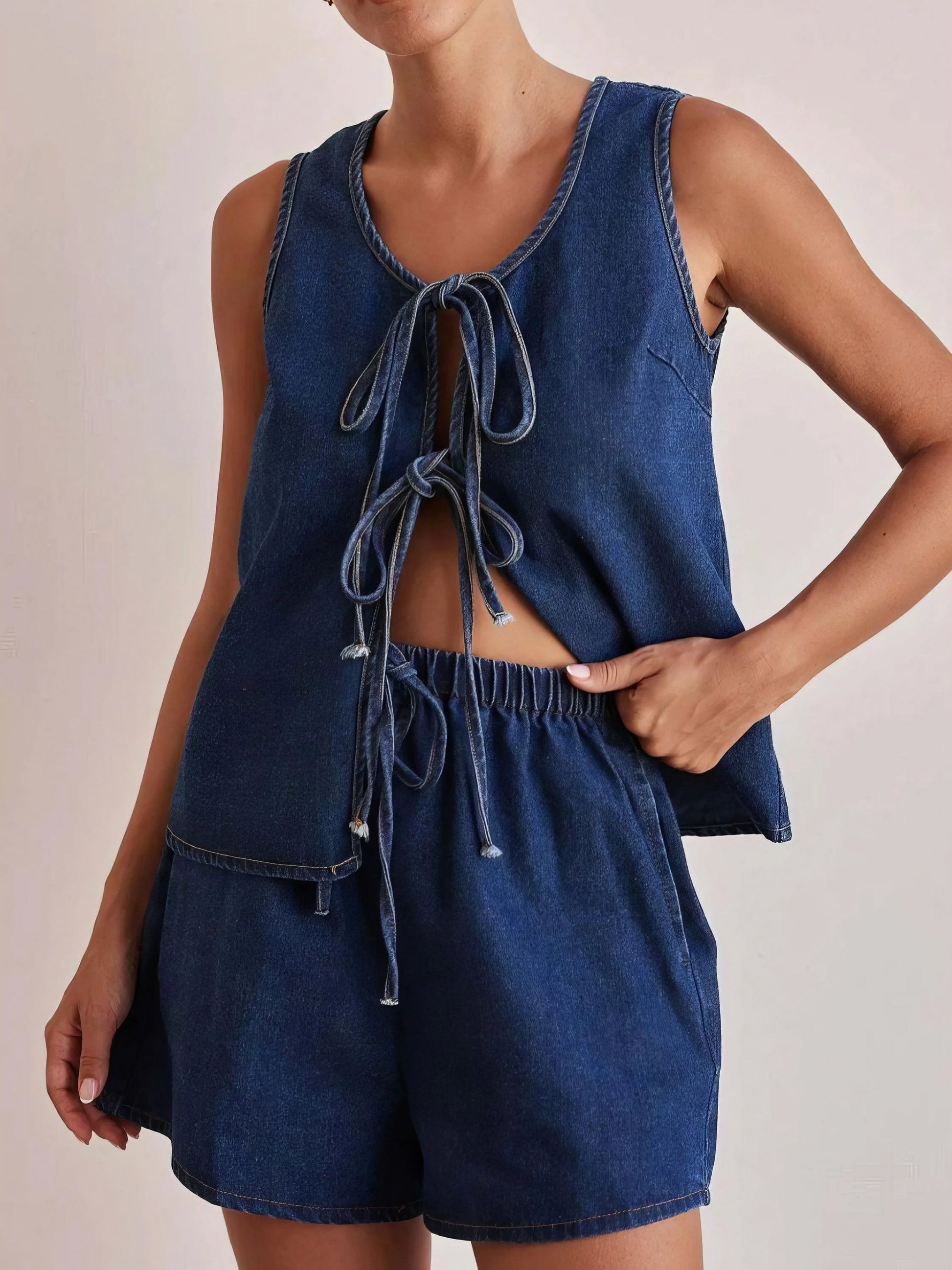 tie front vest and shorts denim set, chic edgy women's outfit, stylish two-piece set, trendy denim ensemble, comfortable vest top, fashionable denim shorts, perfect for a statement look