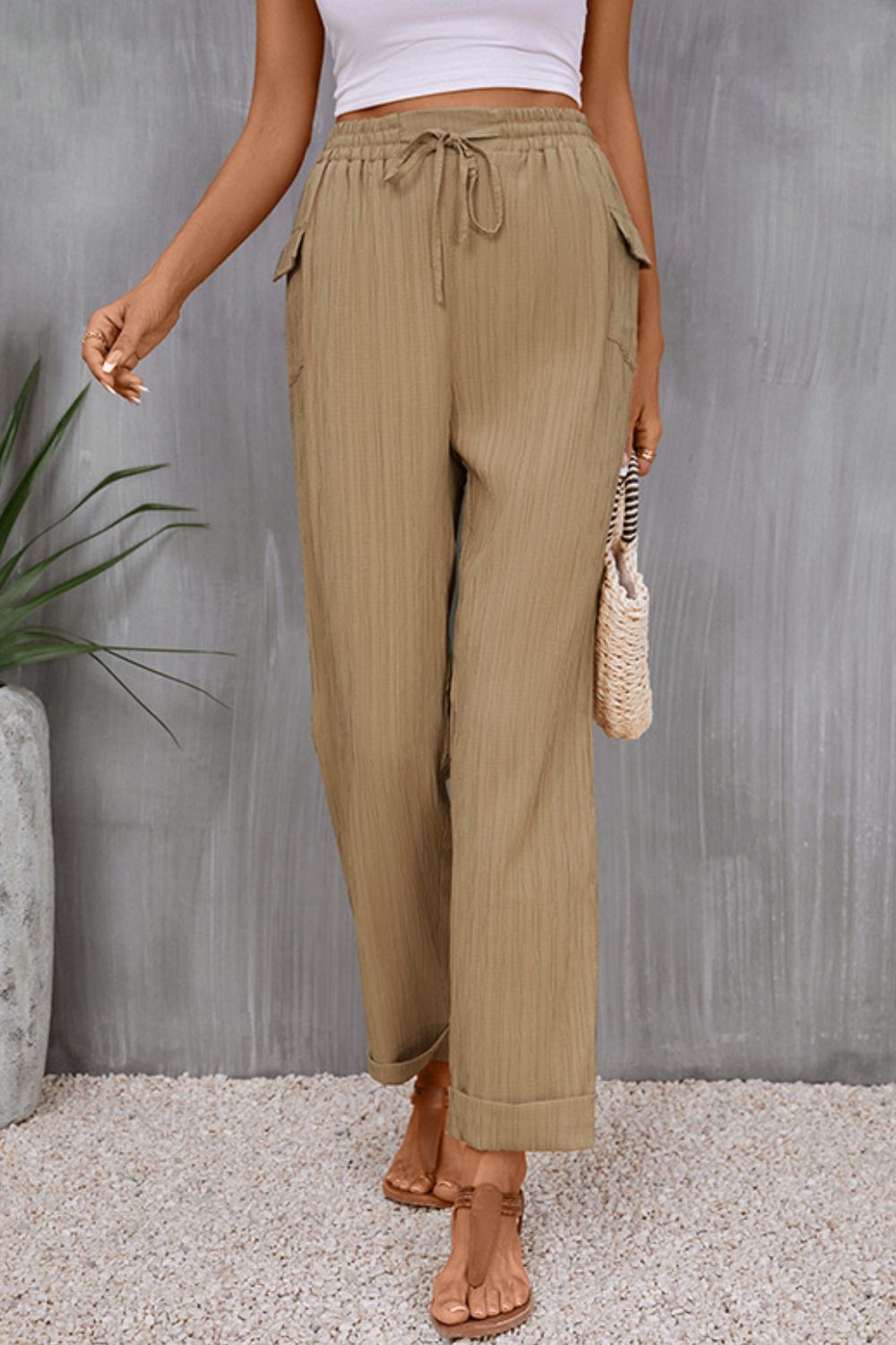 Tie waist pocketed long pants with tie, casual style.
