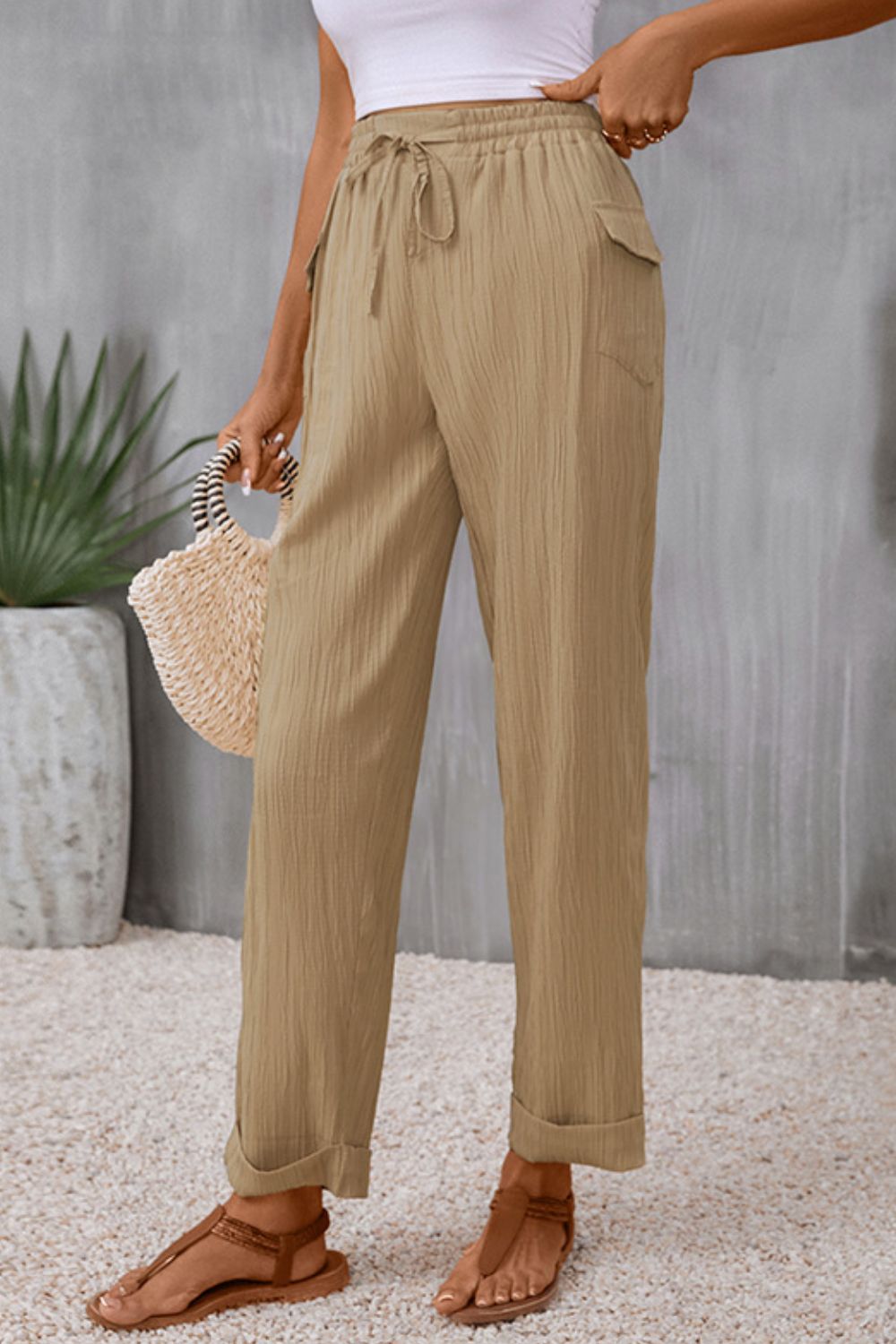 Tie waist pocketed long pants with tie, casual style.