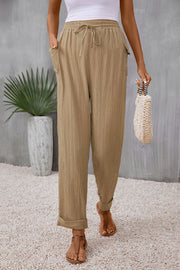 Tie waist pocketed long pants with tie, casual style.