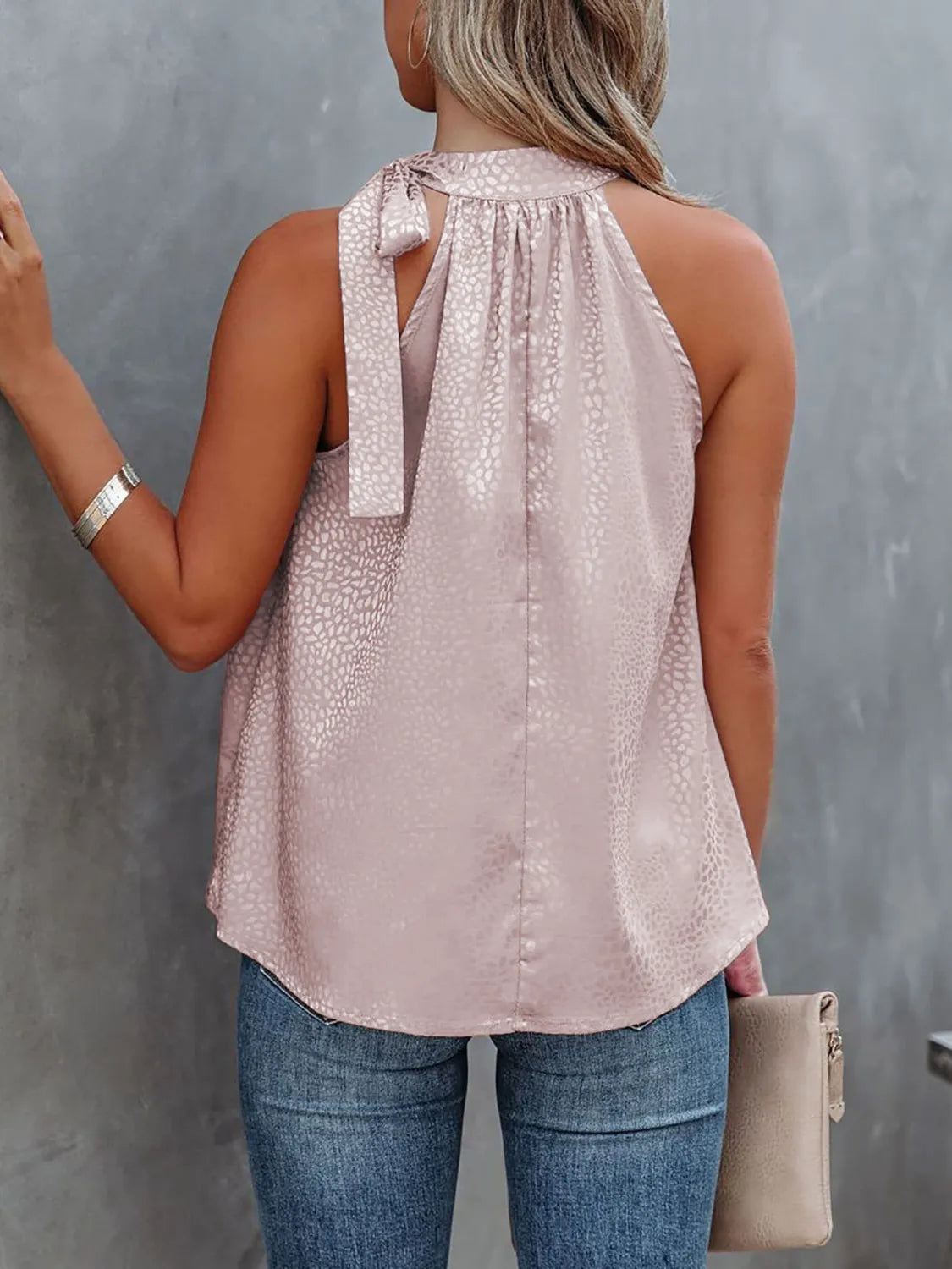 Tied animal print cami with halter neckline.