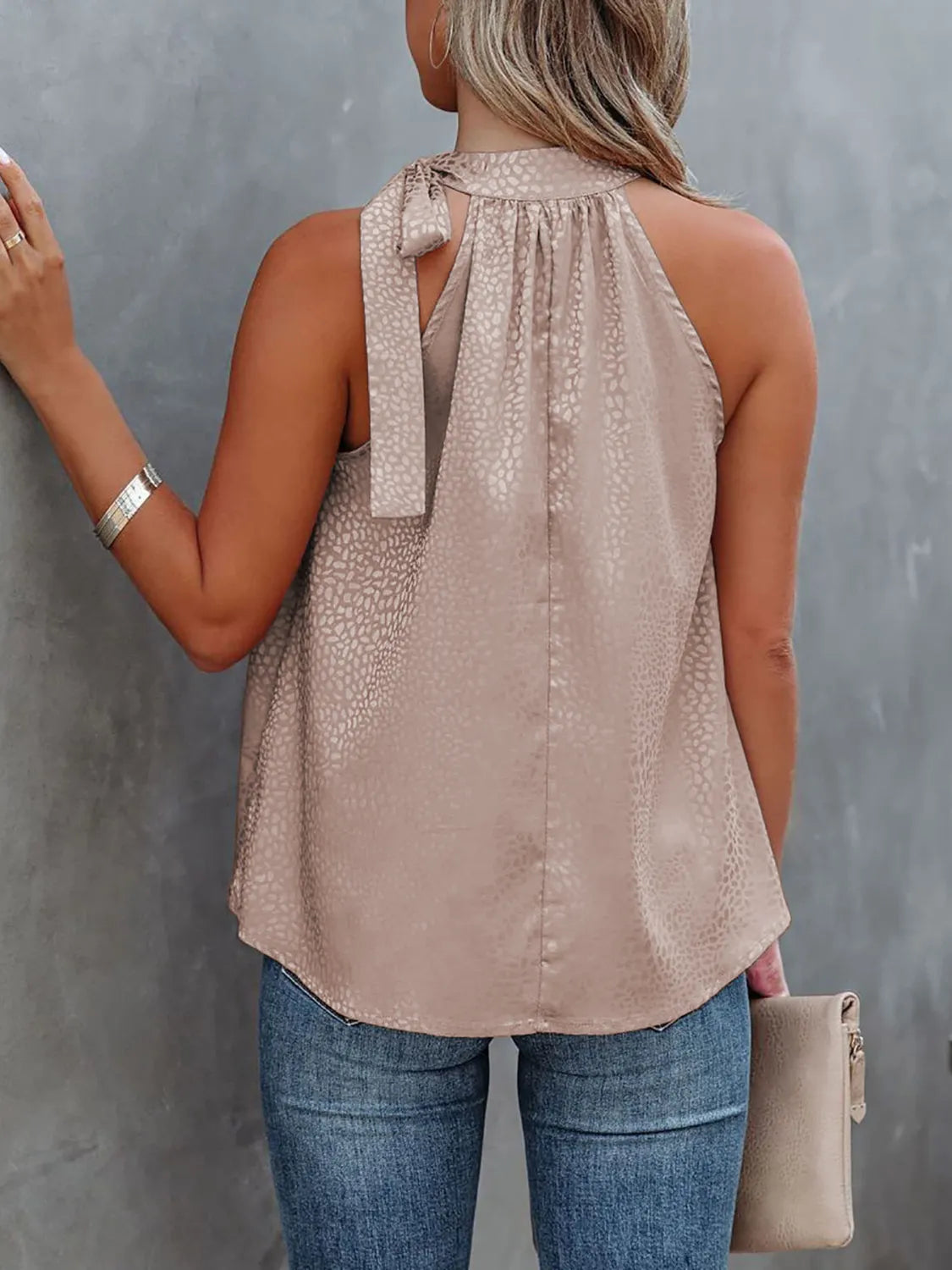 Tied animal print cami with halter neckline.