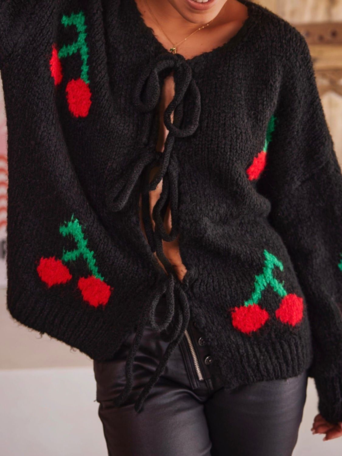 Tied cherry print round neck long sleeve cardigan.