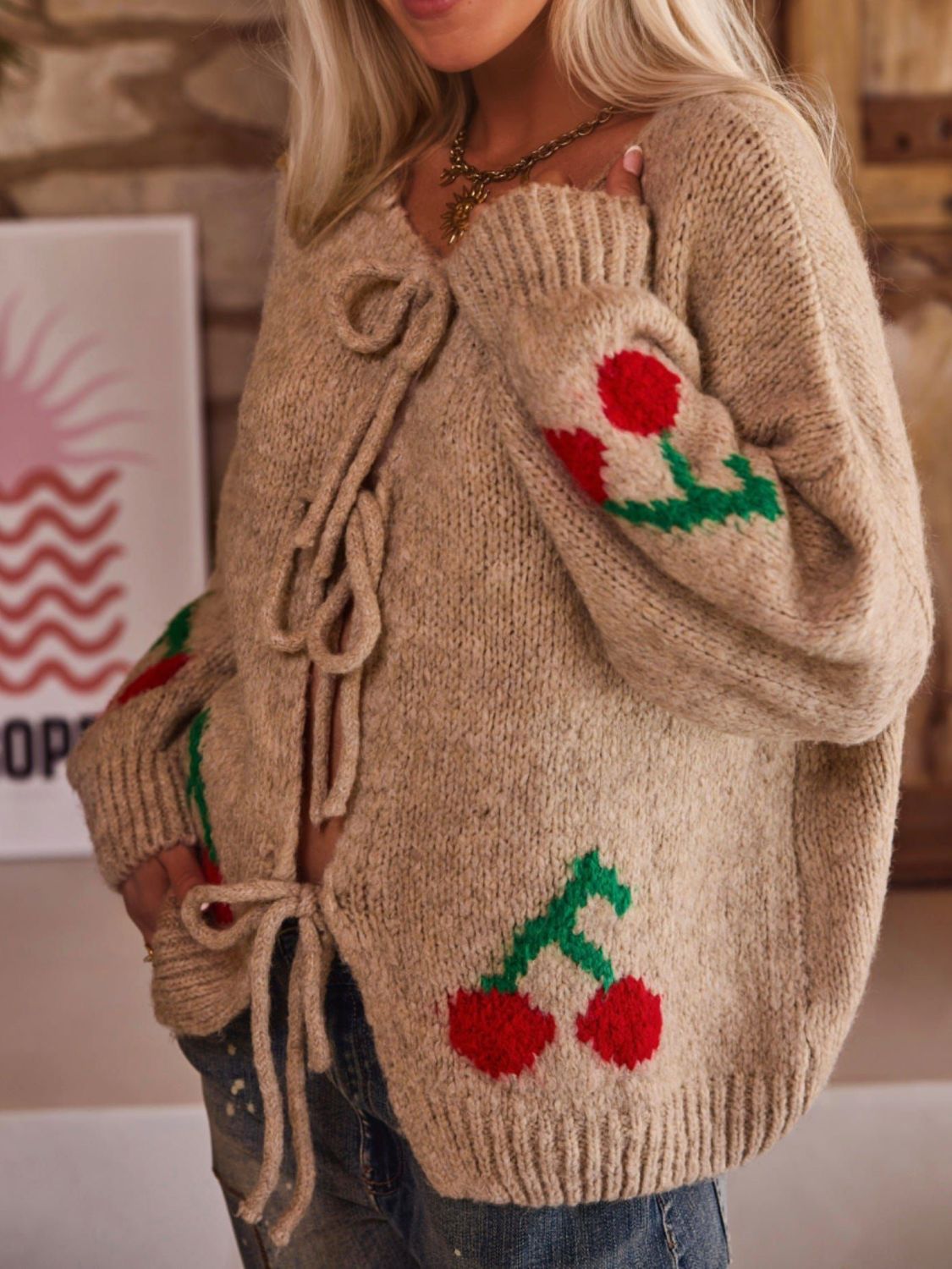 Tied cherry print round neck long sleeve cardigan.