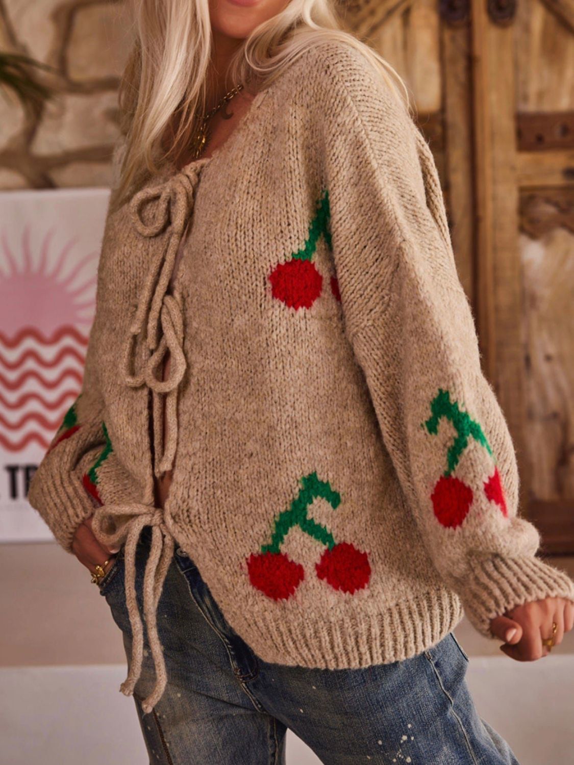 Tied cherry print round neck long sleeve cardigan.