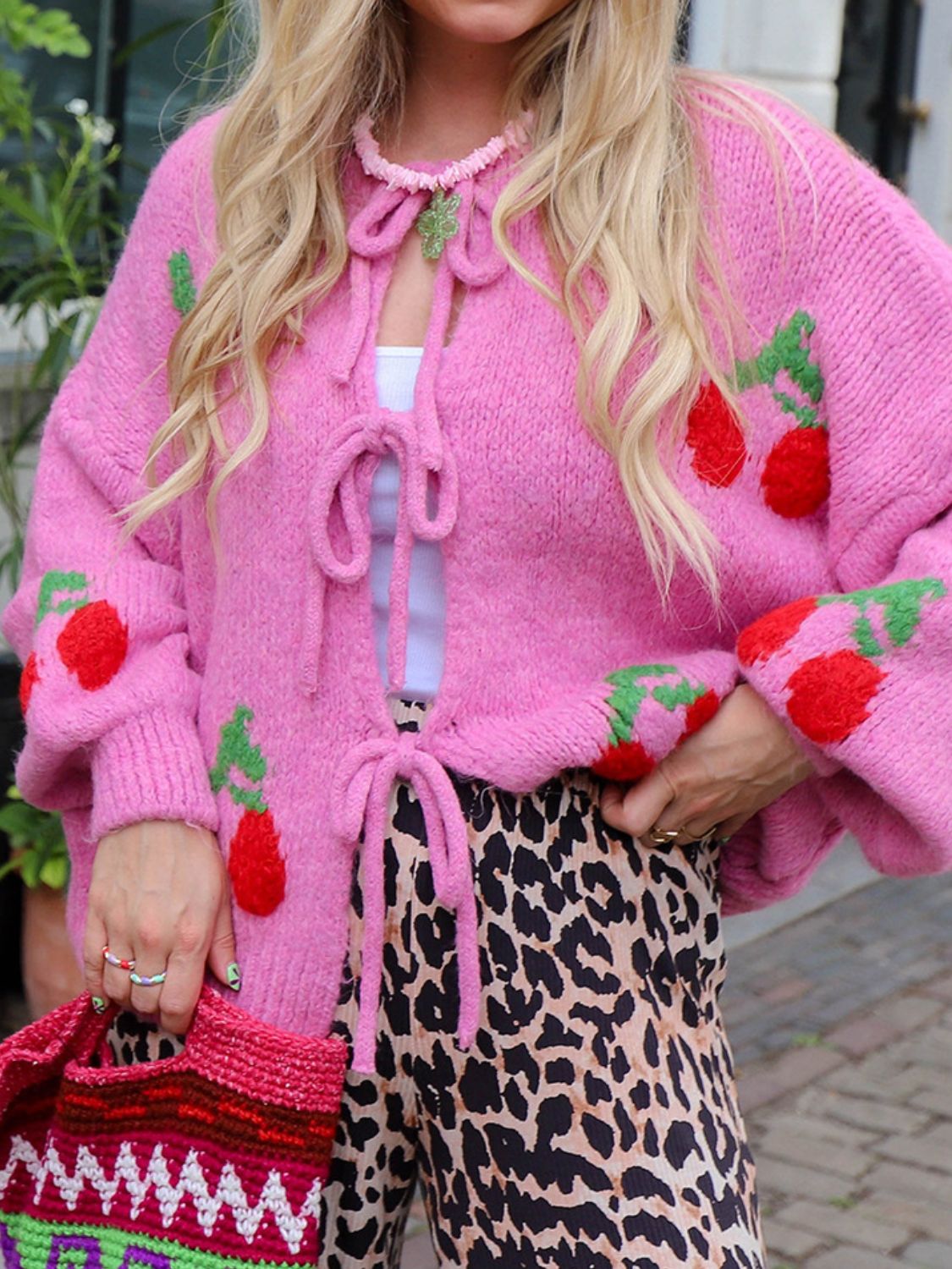 Tied cherry print round neck long sleeve cardigan.