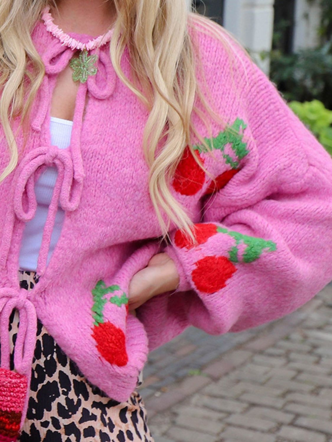 Tied cherry print round neck long sleeve cardigan.