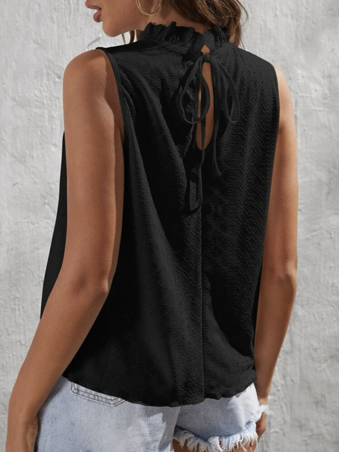 Tied eyelet mock neck tank, opaque and slightly stretchy.