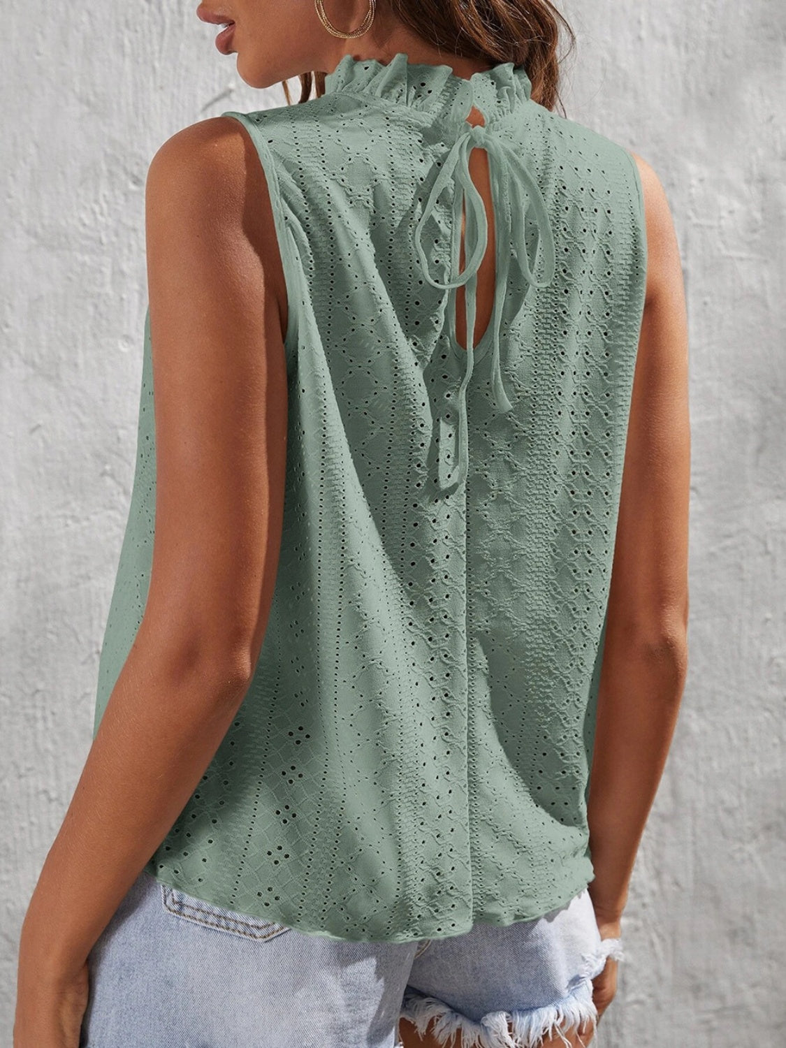 Tied eyelet mock neck tank, opaque and slightly stretchy.