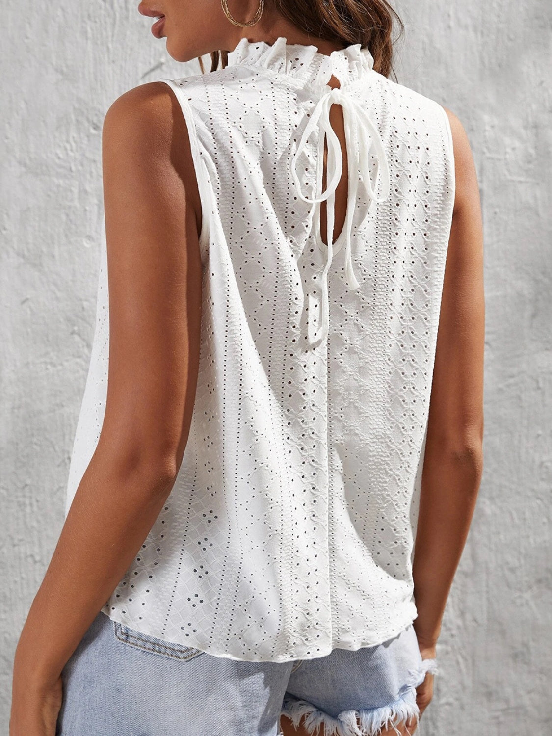 Tied eyelet mock neck tank, opaque and slightly stretchy.