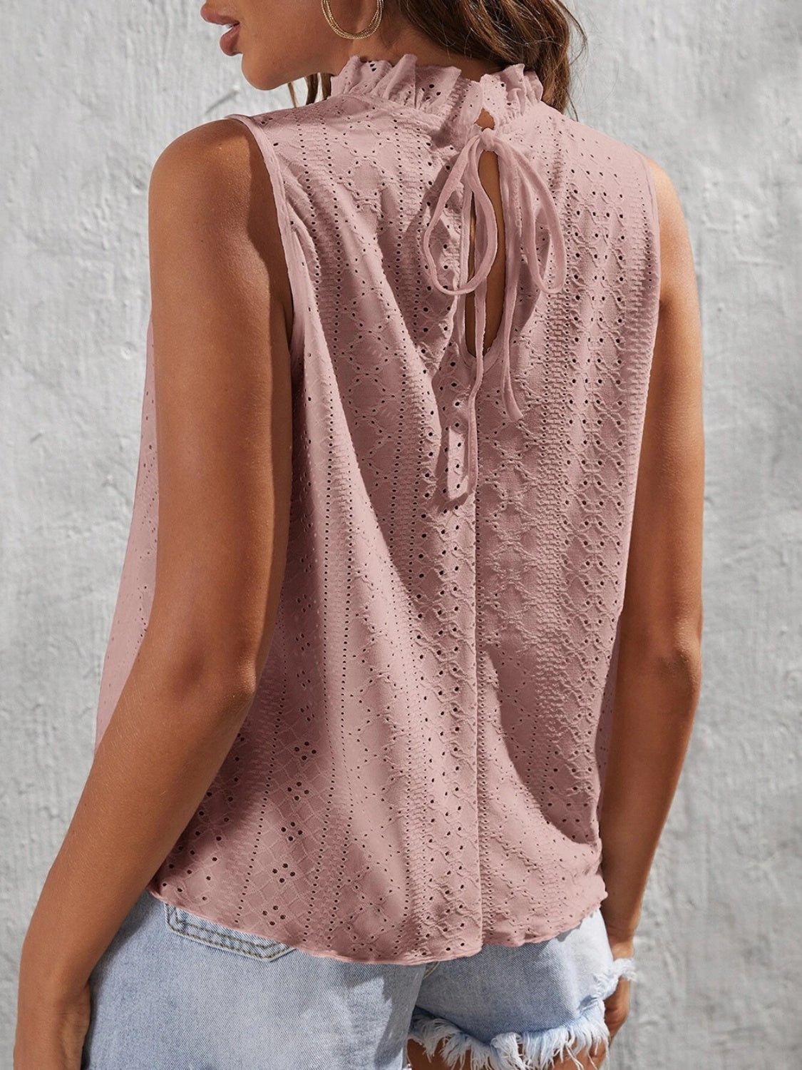 Tied eyelet mock neck tank, opaque and slightly stretchy.