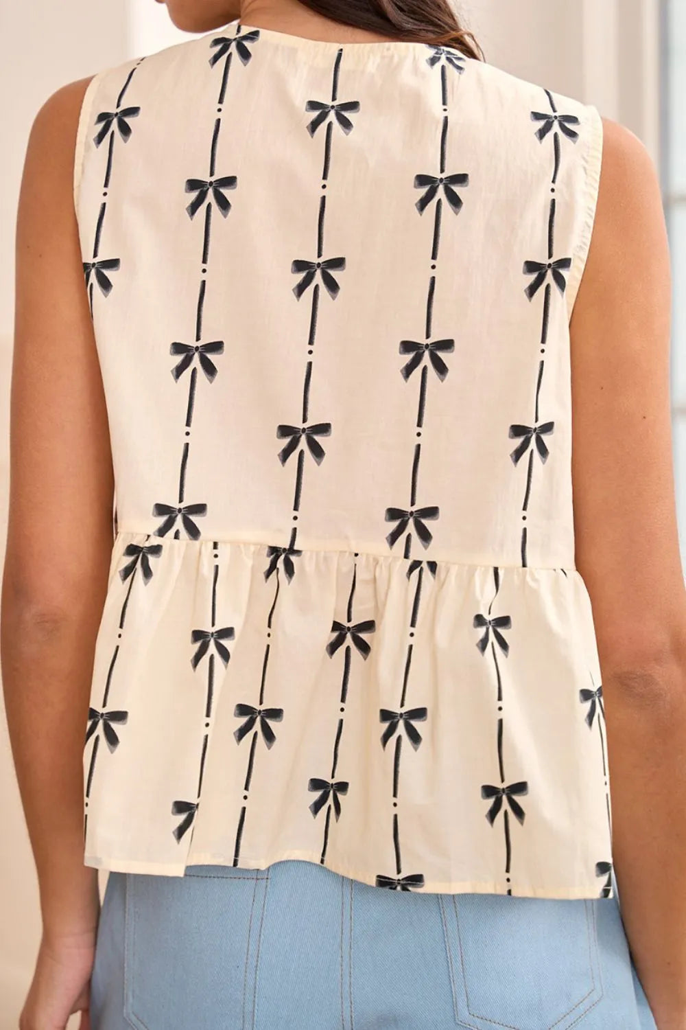 Tied front bow print peplum tank, opaque.