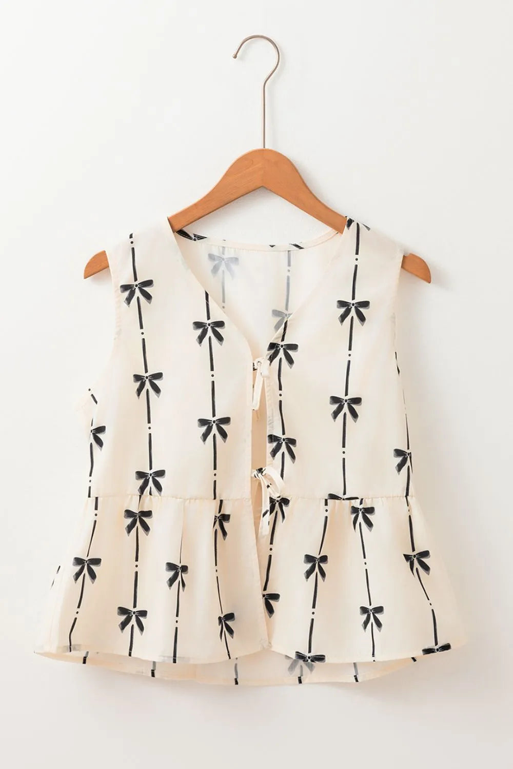 Tied front bow print peplum tank, opaque.