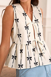 Tied front bow print peplum tank, opaque.