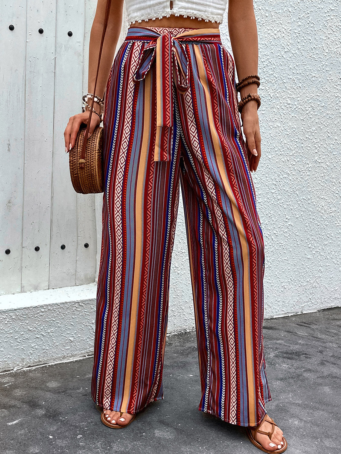 Tied geometric wide leg pants with pockets, opaque.