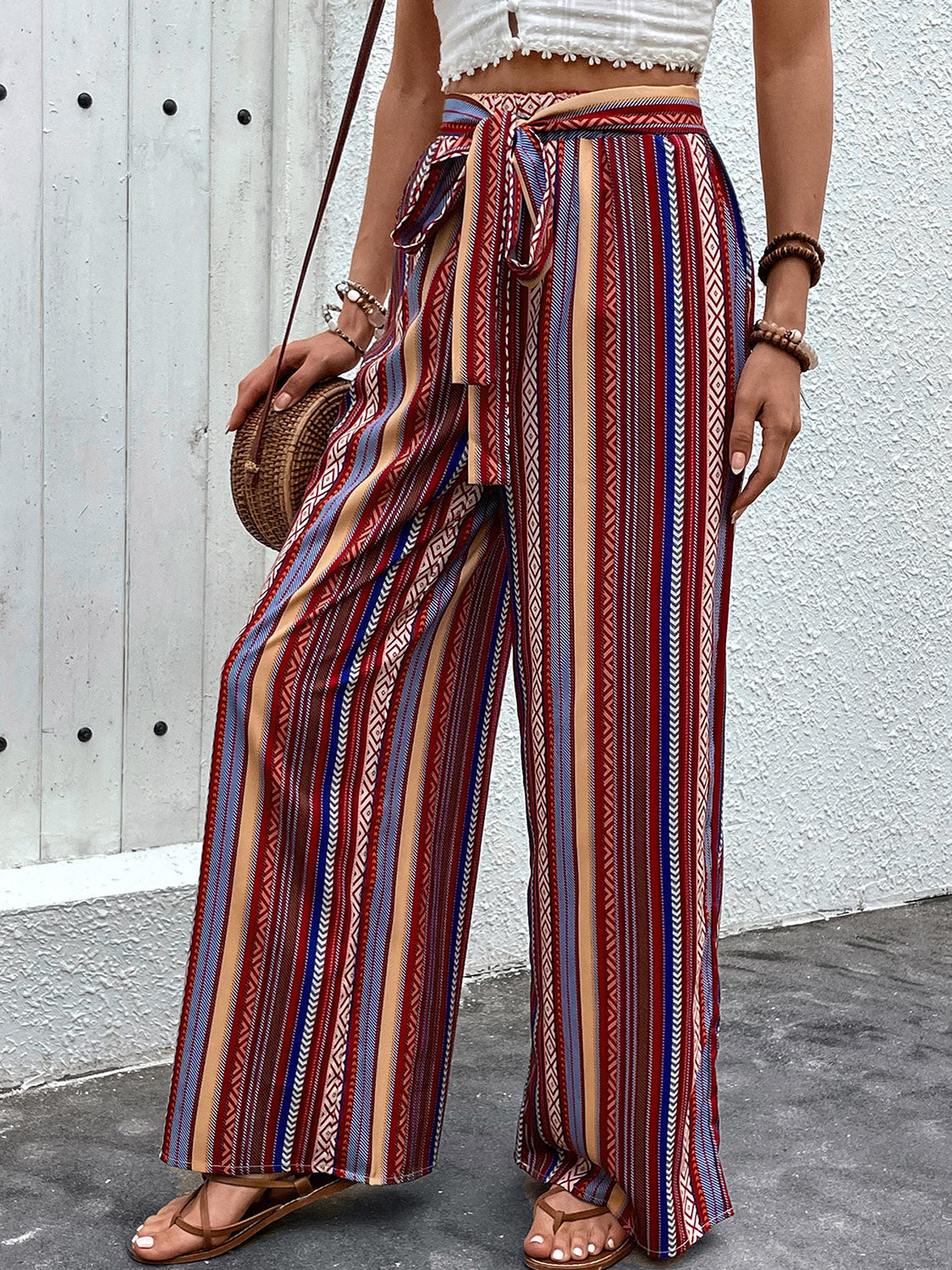 Tied geometric wide leg pants with pockets, opaque.