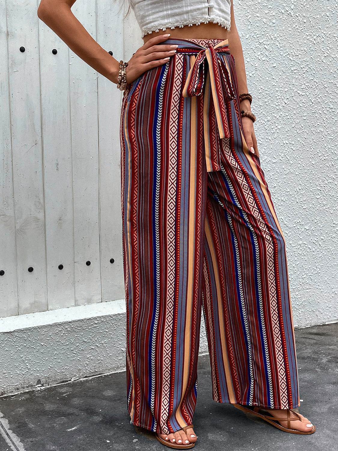 Tied geometric wide leg pants with pockets, opaque.