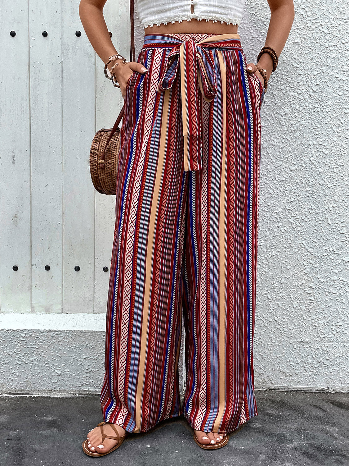 Tied geometric wide leg pants with pockets, opaque.