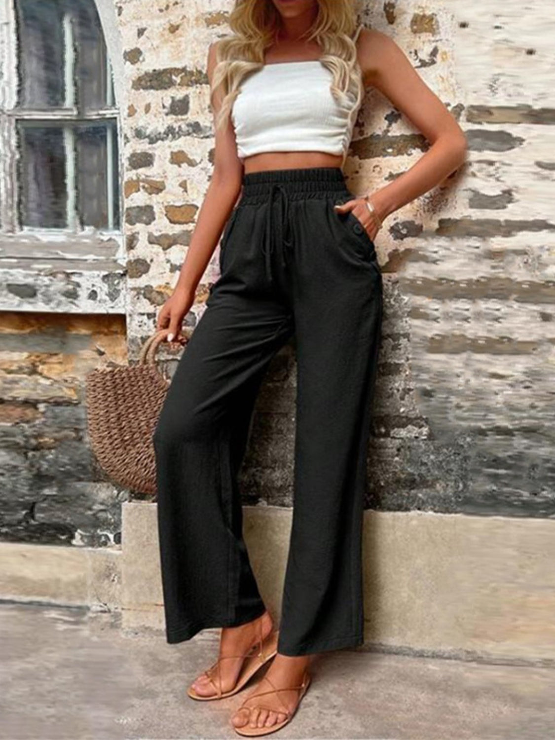 Tied high waist wide leg pants with pockets and decorative buttons, opaque.